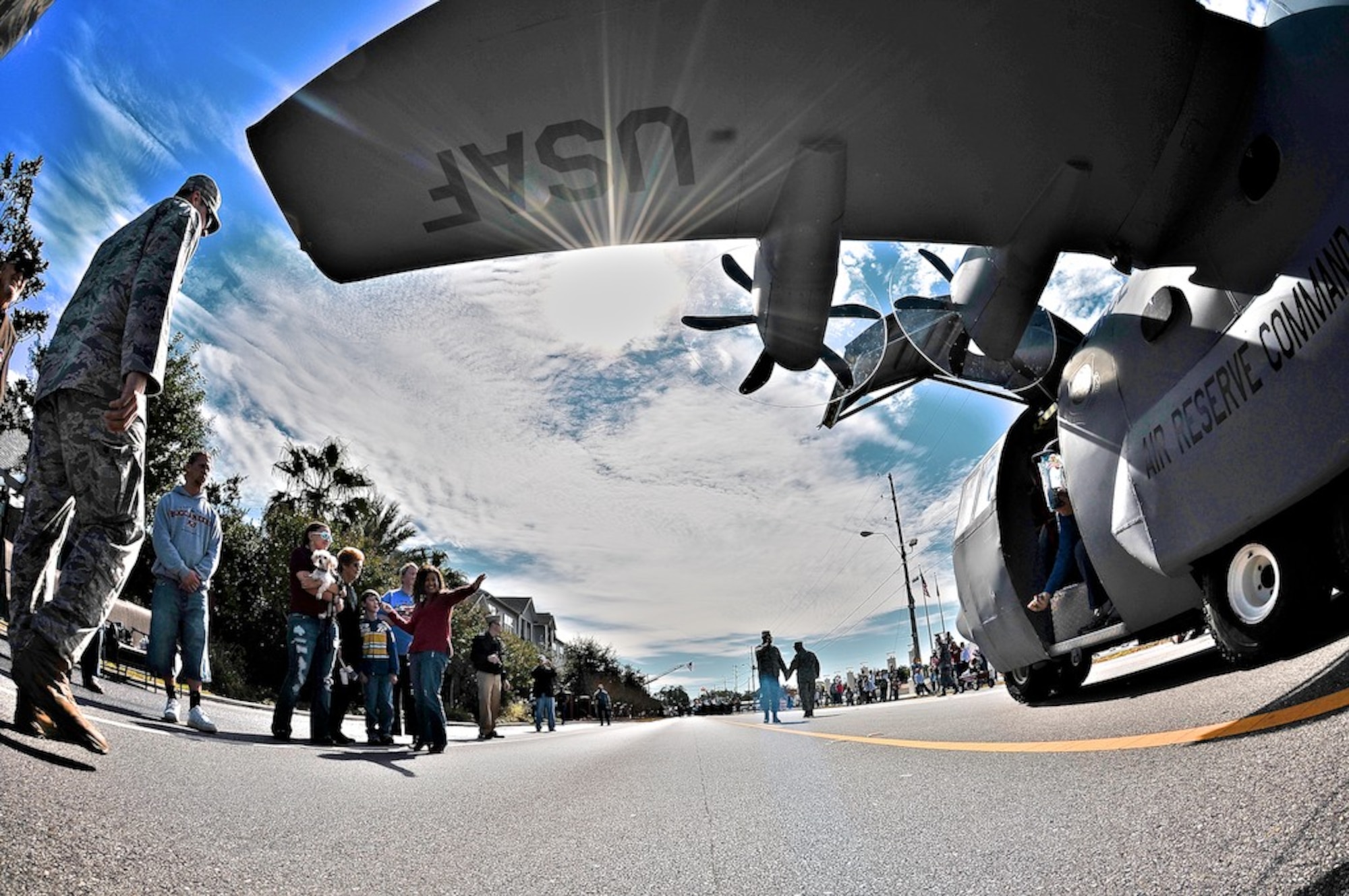 Lil Bill, the 403rd Wing's miniature C-130 aircraft, appeared at the Veteran's Day Parade in D'Iberville, Miss. Col. Jay Jensen, the Commander of the 403rd Wing, drove Lil Bill around the parade route. He's logged many flying hours in a C-130, but never at this altitude, he admits (U.S. Air Force Photo by. Capt. J. Justin Pearce) 