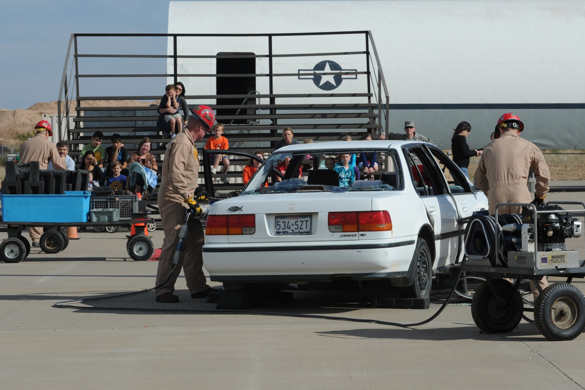 GOODFELLOW AIR FORCE BASE, Texas -- Instructors from the 312th Training Squadron Louis F. Garland Department of Defense Fire Academy, demonstrate vehicle extraction techniques for members of the San Angelo community during Community Appreciation Day Nov. 19. (U.S. Air Force photo/ Staff Sgt. Laura R. McFarlane)