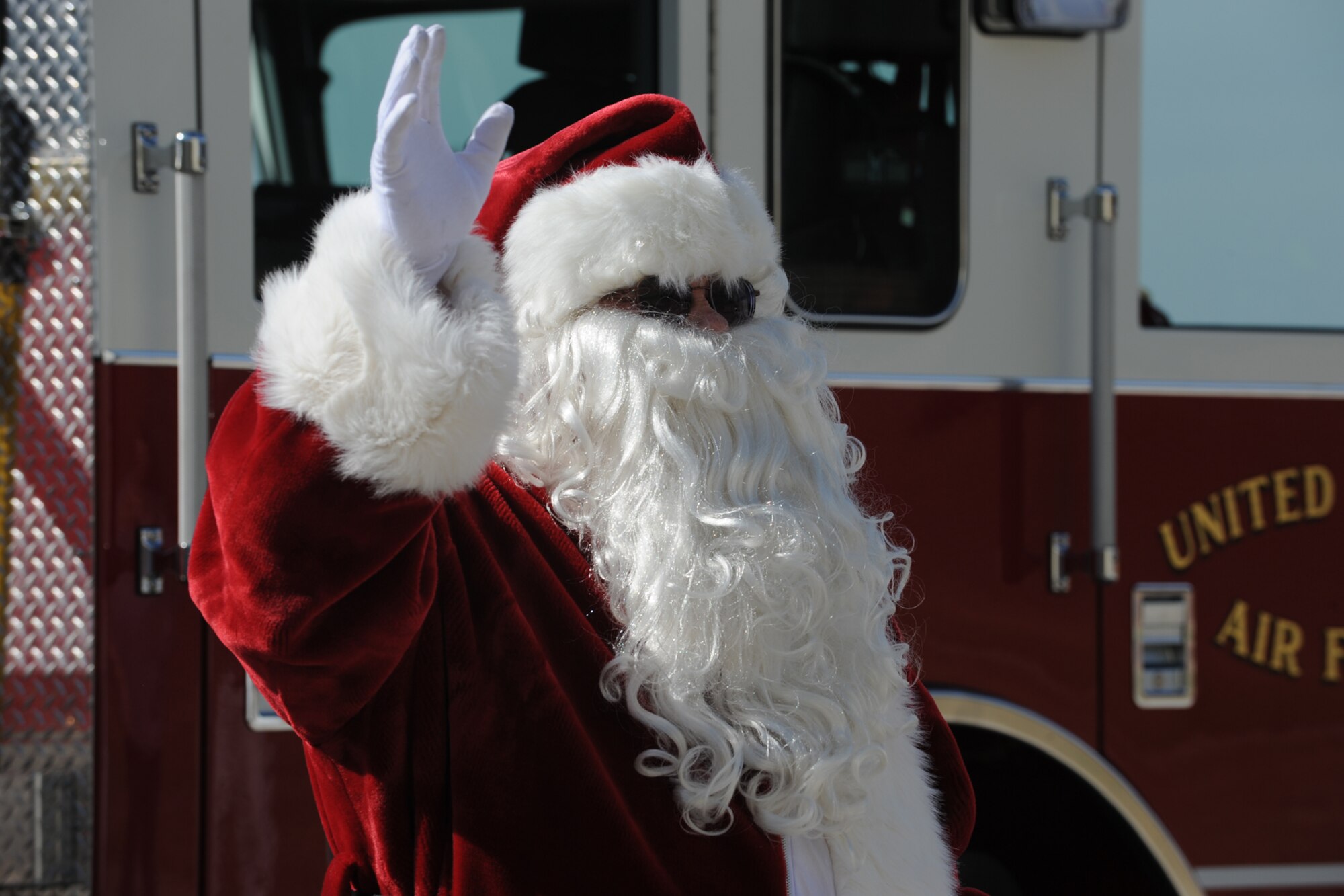 GOODFELLOW AIR FORCE BASE, Texas -- Santa arrives via a fire truck for photo opportunities with the kids during Community Appreciation Day Nov. 19. Other events during the day included firefighting exercises, a live demonstration of military operations in urban terrain, and a bus tour of the base. (U.S. Air Force photo/Staff Sgt. Laura R. McFarlane)