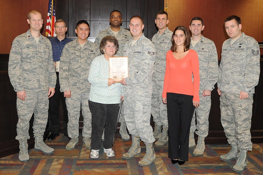 The 4th Fighter Wing legal office poses for a photo at Seymour Johnson Air Force Base, N.C., Nov. 22, 2011. The legal office won the 2011 Ninth Air Force Legal Office of the Year award for their hard work and dedication to the Judge Advocate General?s Corps. (U.S. Air Force photo by Senior Airman Gino Reyes)
