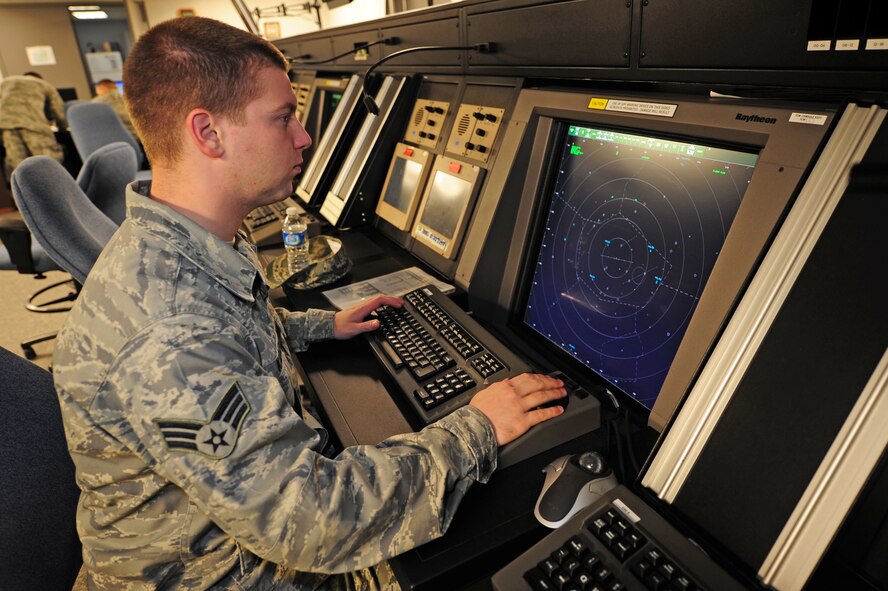 Senior Airman Scott Kababik checks the functions of the radar approach and control screens used by air traffic controllers to ensure they are displaying the correct information for Seymour Johnson Air Force Base, N.C., Nov. 21, 2011. If a screen displays improper information, Airmen from the 4th Communications Squadron (CS) ground radar maintenance flight must troubleshoot the system to find and repair the error before the aircraft here can take to the skies. Kababik, 4 CS ground radar systems technician, is a native of Parkton, N.C. (U.S. Air Force photo by Senior Airman Rae Perry)