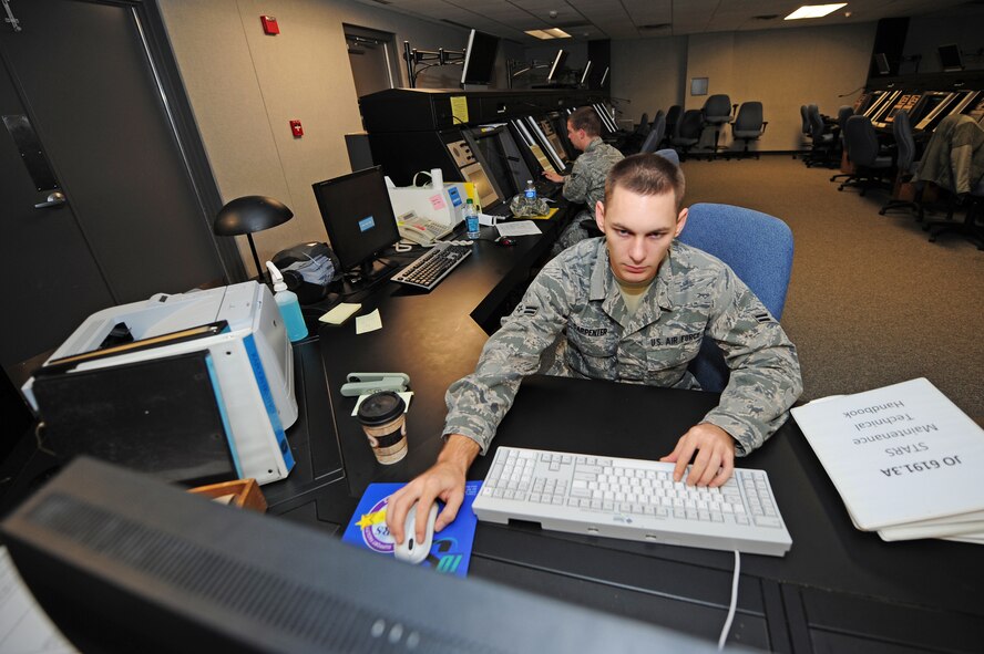 Airman 1st Class Joseph Carpenter performs a nightly check of the radar approach and control (RAPCON) system on Seymour Johnson Air Force Base, N.C., Nov. 21, 2011.  Airmen at the RAPCON center use the Digital Air Surveillance Radar to track aircraft, large flocks of birds and weather patterns so air traffic controllers can best guide pilots through the hazards. Carpenter, 4th Communications Squadron ground radar systems technician, is a native of Pittsburgh. (U.S. Air Force photo by Senior Airman Rae Perry)