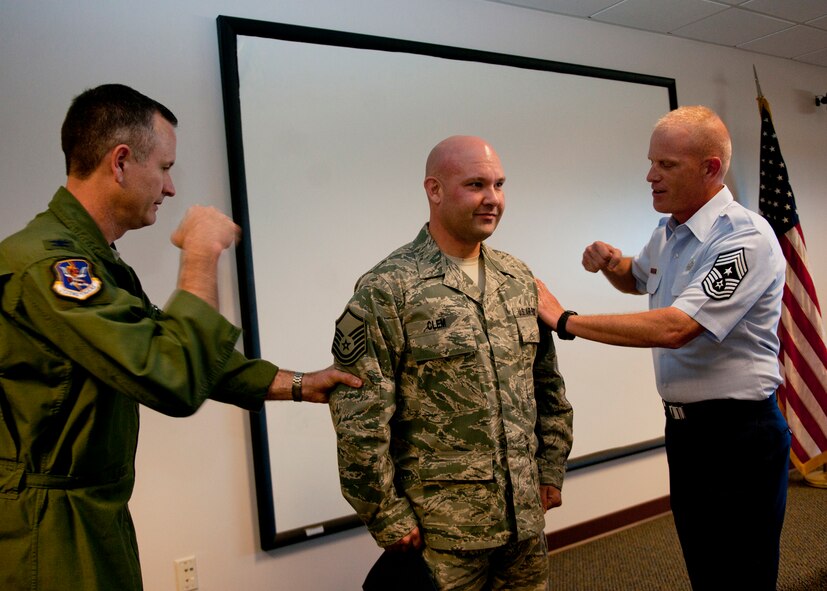 U.S. Air Force Tech. Sgt. Robert Clem, 23rd Logistics Readiness Squadron, is promoted to the rank of master sergeant by Col. Billy Thompson, 23rd Wing commander, and Chief Master Sgt. Frank Batten, 23rd Wing command chief, under the Stripes for Exceptional Performers program at the Deployment Control Center, Moody Air Force Base, Ga., Nov. 21, 2011. The Air Force releases a limited number of STEP promotion slots each year and are distributed to the major commands. (U.S. Air Force photo by Senior Airman Eileen Meier/Released)