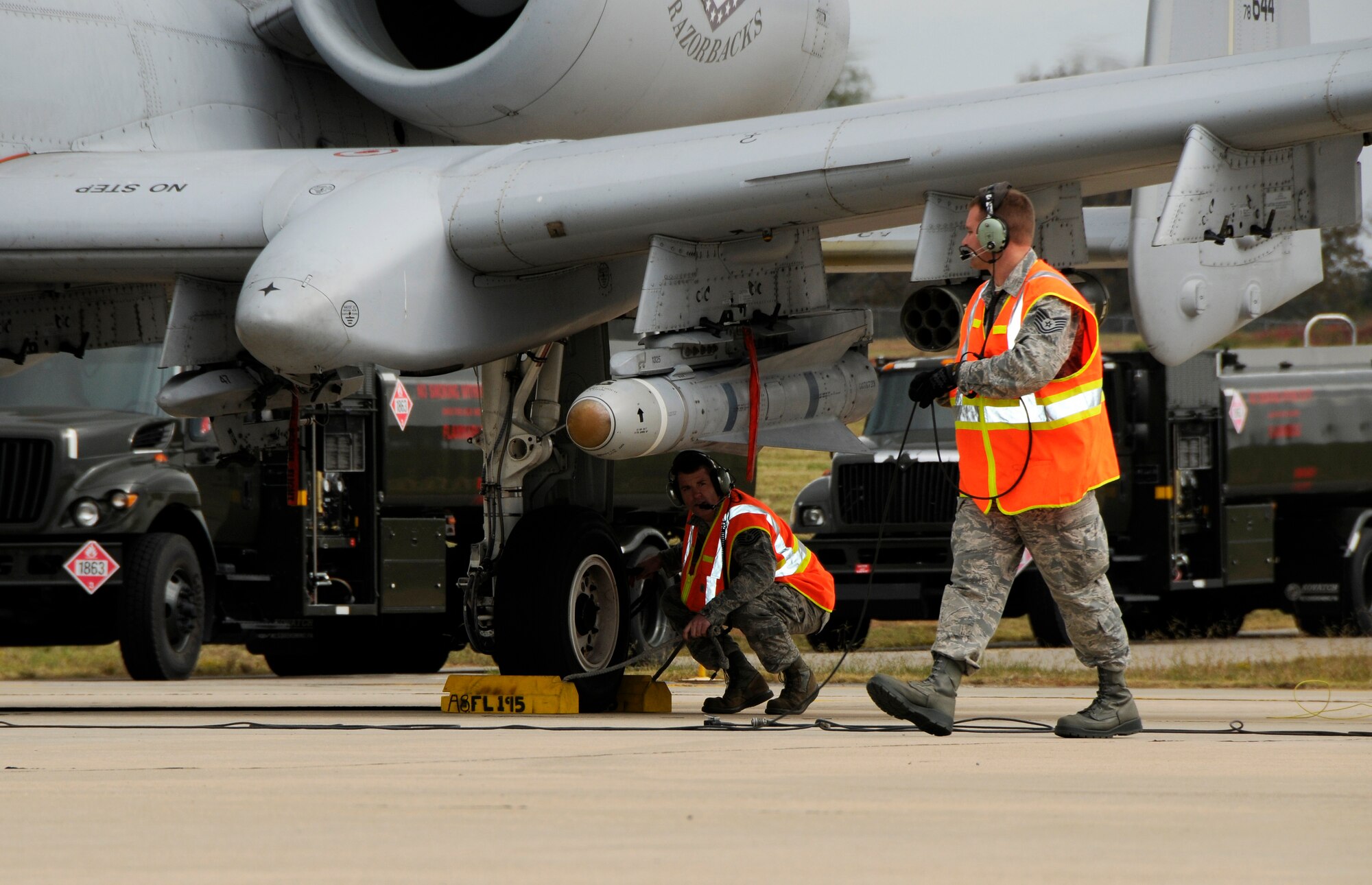 Airmen with the 188th Fighter Wing conduct “hot-pit” refueling during a Unit Training Assembly at the 188th Nov. 6. The process is required training for Airmen and is a common practice in the Unites States Central Command Area of Responsibility. The objective of the process is to increase the number of sorties by decreasing the number of thru-flight inspections required each time the engines shut down. (U.S. Air Force photo by Airman 1st Class Hannah Landeros/188th Fighter Wing Public Affairs)