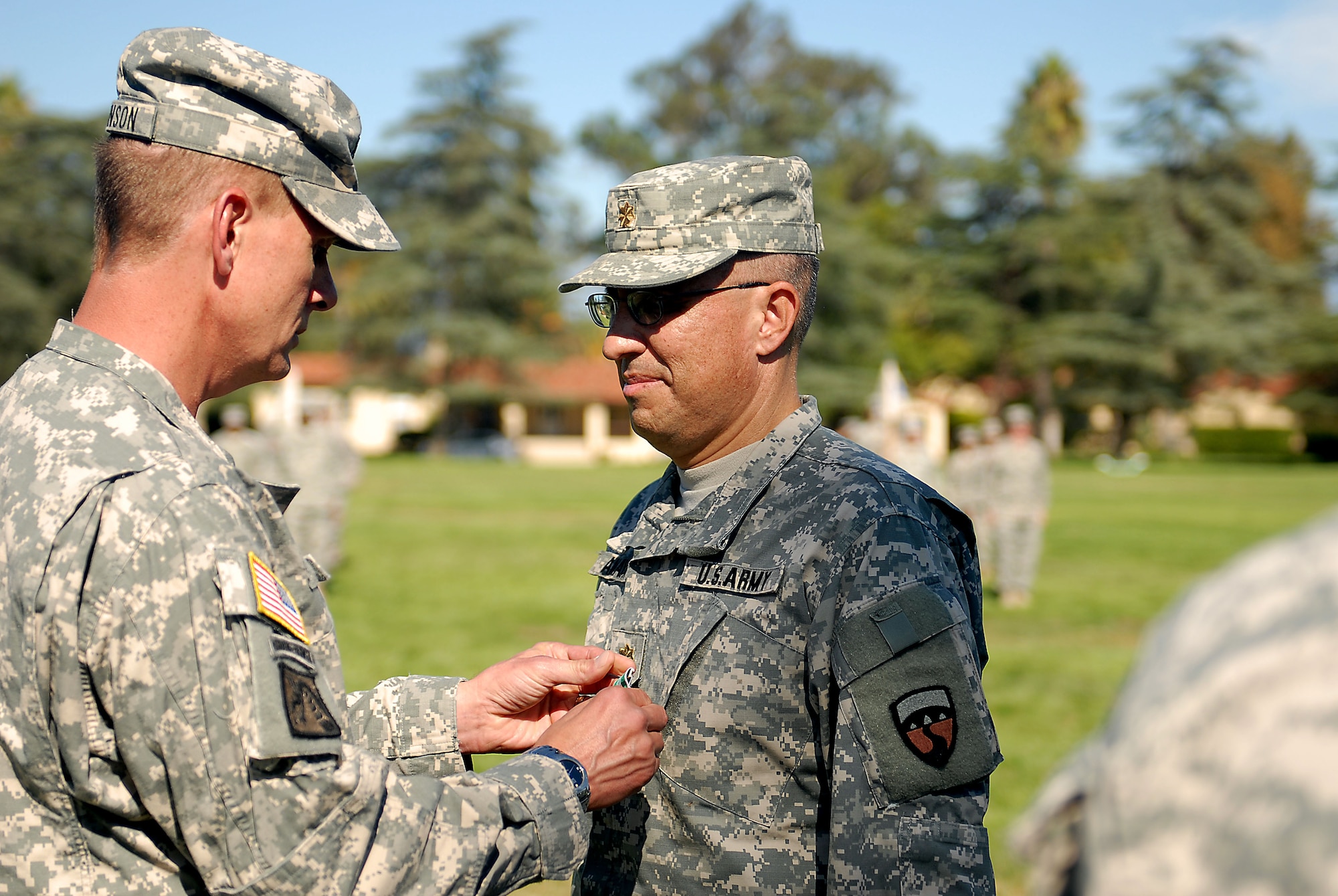 Army Col. Scott Swanson, commander of the 304th Sustainment Brigade, pins the Army Commendation Medal on Army Maj. Edward Amaya, the outgoing commander of the brigade’s Special Troops Battalion, in a ceremony held Sunday, Oct. 9, 2011 at March Air Reserve Base, Calif. Amaya has commanded the battalion since returning from Iraq in 2008 and will now hold a position in the Operations Section at the 311th Sustainment Command (Expeditionary) in Los Angeles. (US Army photo by Sgt. Ruben Chicas)