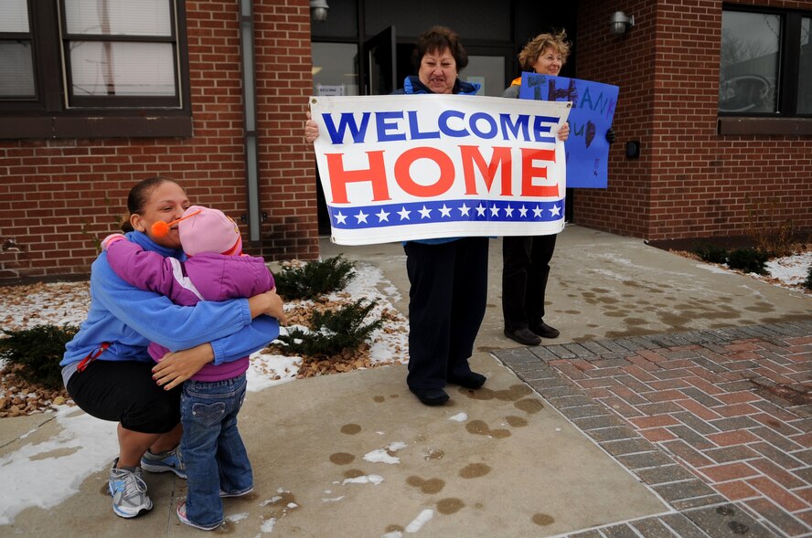 Kaija Tilstra greets her daughter, Sadie, at the welcome home ceremony after a simulated deployment on Grand Forks Air Force Base, N.D., Nov. 19.  The base hosted a deployment line for children of affiliated military families to get a feel of the process when a parent deploys.  (U.S. Air Force photo by Senior Airman Amanda N. Grabiec)