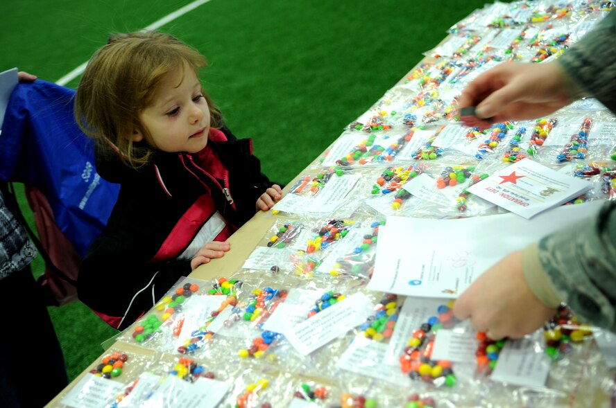 Samantha Bentley, daughter of Staff Sgt. Julane Bentley, 319th Air Base Wing Safety, begins the process of a deployment line on Grand Forks Air Force Base, N.D., Nov. 19.  The base hosted a deployment line for children of affiliated military families to get a feel of the process when a parent deploys.  (U.S. Air Force photo by Senior Airman Amanda N. Grabiec)