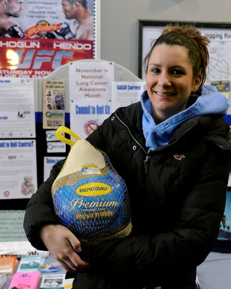 MINOT AIR FORCE BASE, N.D. -- Rebecca Merrill, a spouse here, was one of several individuals who were presented with a turkey for winning a drawing held as part of the 36th Annual Great American Smokeout Nov. 17. Here at Minot AFB, over 30 Airmen and their dependents took the pledge to quit smoking. As a reward for that pledge, they were entered into the drawing to win a free turkey. (U.S. Air Force photo/Airman 1st Class Stephanie Ashley)

