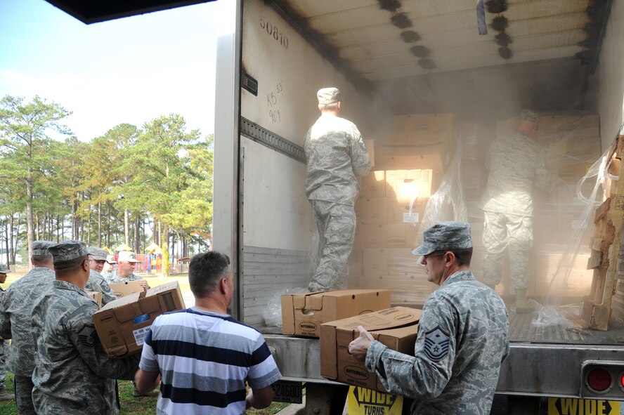 Master Sgts. Donald Huston and Joe Cason remove boxed turkeys from a Butterball truck on Seymour Johnson Air Force Base, N.C., Nov. 21, 2011. This is Butterball?s fourth year donating turkeys to Airmen to show their appreciation for the military. Huston is from Marietta, Ohio and Cason is a native of Sulpher Springs, Texas. (U.S. Air Force photo by Senior Airman Whitney Stanfield)