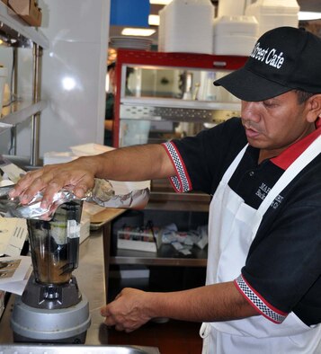 Federico Ramirez, Back Street Cafe cook,  prepares a sauce for a pork dish he prepared Nov. 15, 2011, during a chef competition at March Air Reserve Base, Calif.  Cooks were given four ingredients, a specific cooking method and 45 minutes to prepare a dish.  (U.S. Air Force photo/Linda Welz)