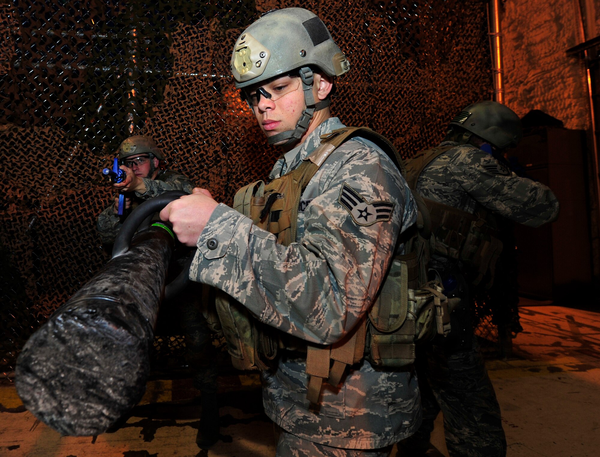 MINOT AIR FORCE BASE, N.D. -- Members of the 91st Security Forces Group tactical response team, engage in exercise clearing scenarios here Nov. 3. TRF is one of the most physically demanding jobs that security forces personnel can be apart of here. The 91st SFG has continued its ongoing effort of physical assessments designed to help their Airmen maintain full capability of their bodies throughout their Air Force careers. (U.S. Air Force photo/ Senior Airman Ashley N. Avecilla) 

