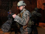 MINOT AIR FORCE BASE, N.D. -- Members of the 91st Security Forces Group tactical response team, engage in exercise clearing scenarios here Nov. 3. TRF is one of the most physically demanding jobs that security forces personnel can be apart of here. The 91st SFG has continued its ongoing effort of physical assessments designed to help their Airmen maintain full capability of their bodies throughout their Air Force careers. (U.S. Air Force photo/ Senior Airman Ashley N. Avecilla) 

