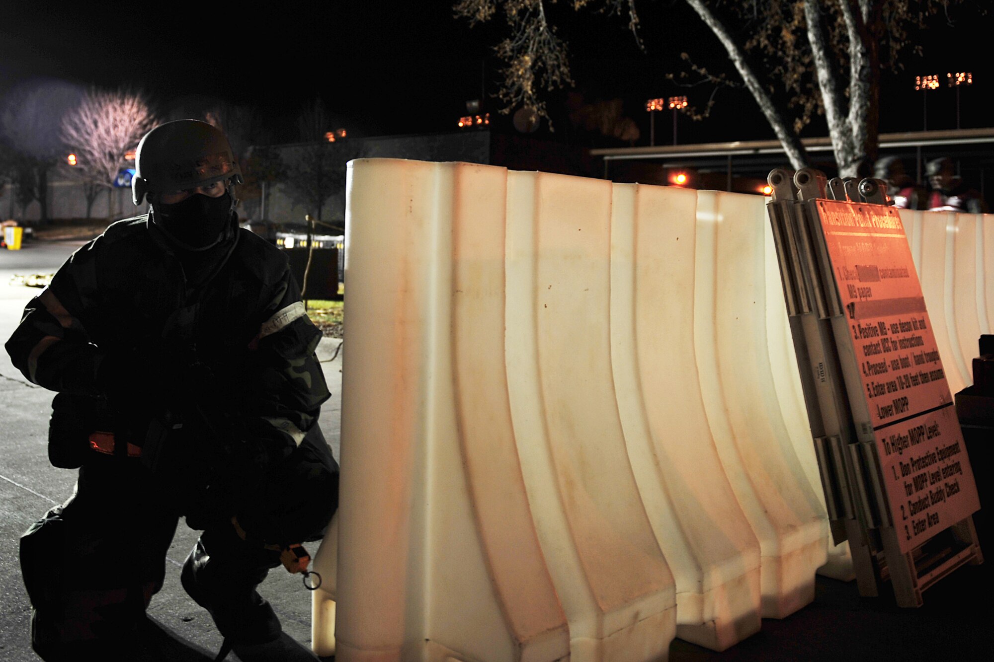 U.S. Air Force Staff Sgt. Kevin Ragsdale, 55th Aerospace Medical Squadron, protects an entry control point during an operational readiness exercise at Offutt Air Force Base, Neb., Nov. 17. Team Offutt members participated in an ORE that tested their ability to handle simulated injuries, attacks and various obstacles in which they may encounter at deployed locations around the world. (U.S. Air Force Photo by Charles Haymond/Released).