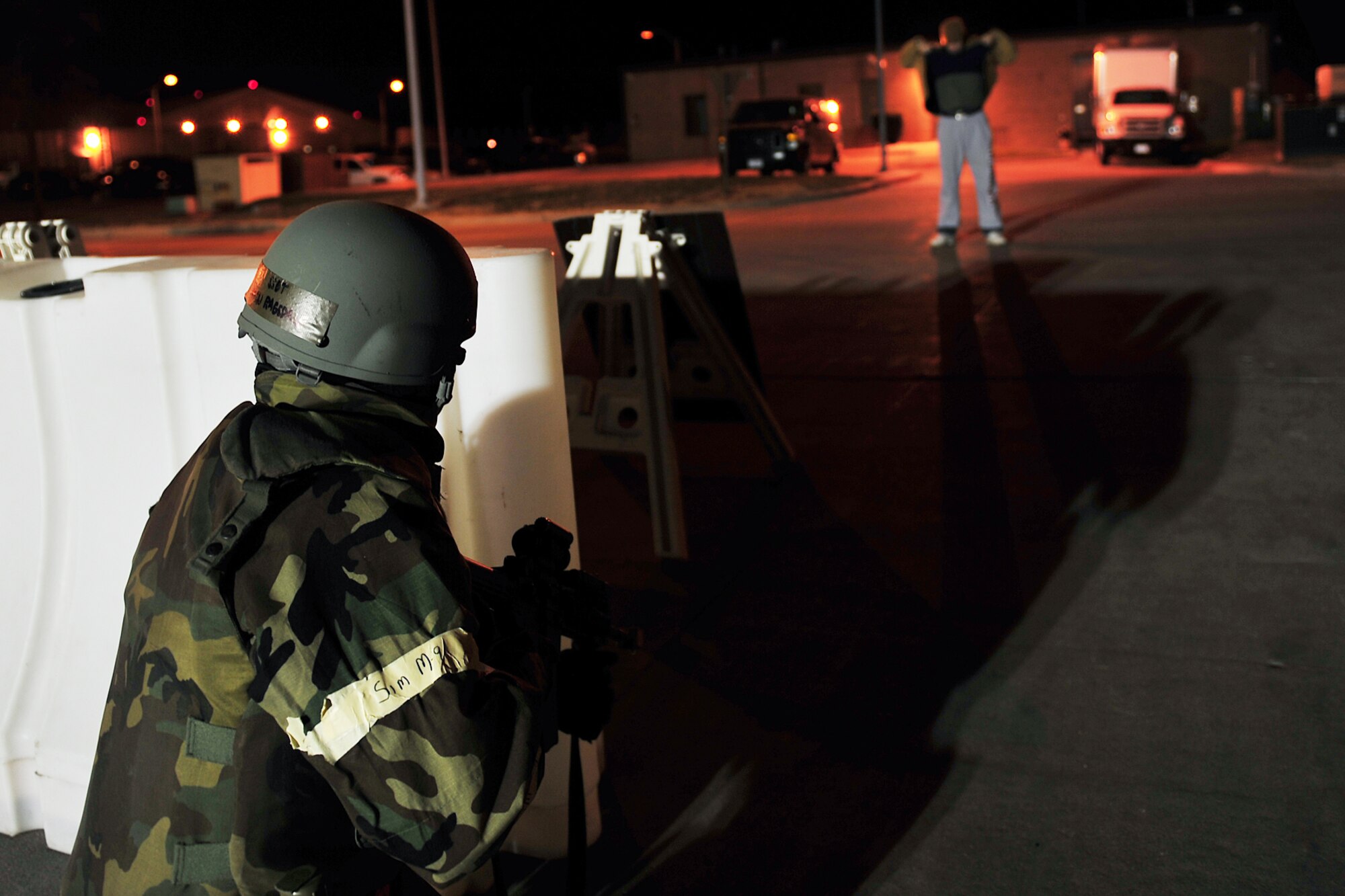 U.S. Air Force Staff Sgt. Kevin Ragsdale, 55th Aerospace Medical Squadron, detains a person carrying a simulated bomb during an operational readiness exercise at Offutt Air Force Base, Neb., Nov. 17. During the ORE, Team Offutt members practiced skills to enhance readiness for real world scenarios at deployed locations around the world. (U.S. Air Force Photo by Charles Haymond/Released). 