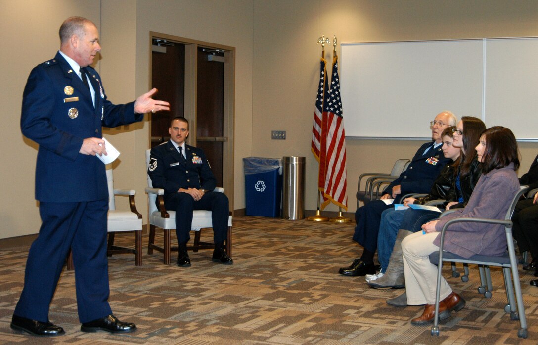 Brig. Gen. Kevin Jacobsen, Air Force Office of Special Investigations commander, talks to the family of Special Agent Frank McBride, who was being honored with a Bronze Star Medal. SA McBride received the medal in recognition of his work supporting the Combined Joint Special Operations Task Force Afghanistan in 2010-2011. (U.S. Air Force Photo by Mr. James C. Dillard.)