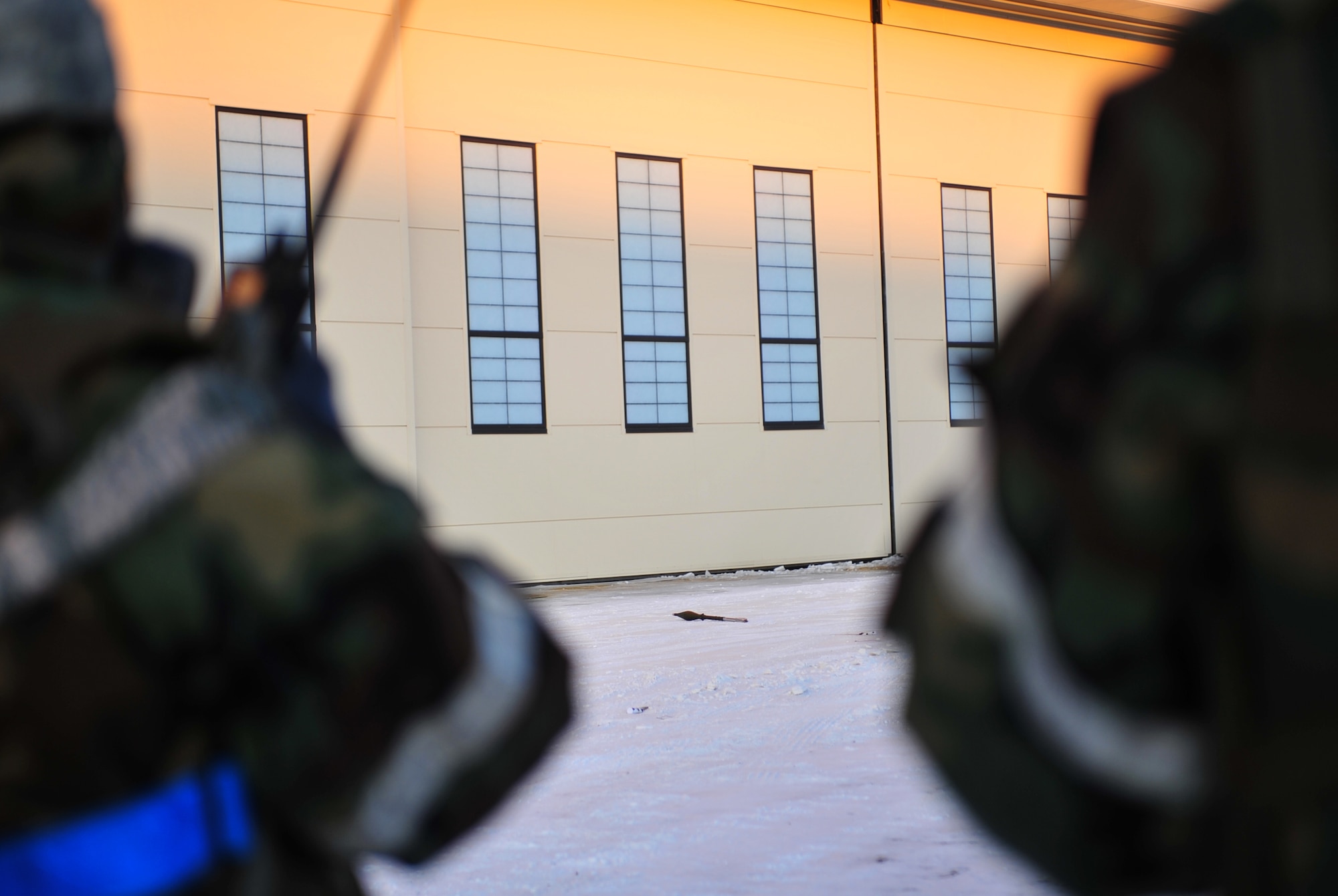 Members of a Post Attack Reconnaissance team cordon off a simulated unexploded ordnance during Exercise Polar Force 11-10 at  Joint Base Elmendorf-Richardson, Alaska, Nov. 17, 2011. The exercise is made up of a variety of scenarios which test the arctic warriors' ability to handle real world situations. (U.S. Air Force photo/Staff Sgt. Sheila deVera)