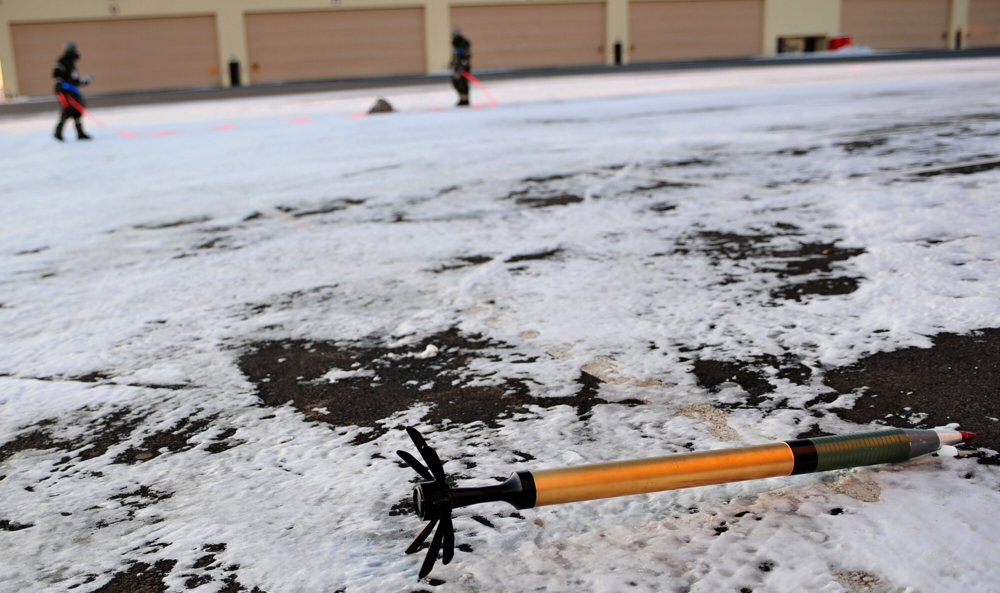 Members of a Post Attack Reconnaissance team cordon off a simulated unexploded ordnance during Exercise Polar Force 11-10 at  Joint Base Elmendorf-Richardson, Alaska, Nov. 17, 2011. The exercise is made up of a variety of scenarios which test the arctic warriors' ability to handle real world situations. (U.S. Air Force photo/Staff Sgt. Sheila deVera)

