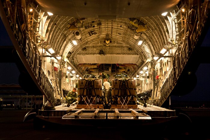 U.S. Air Force Airmen secure cargo on to a C-17 Globemaster during Mobility Air Forces Exercise on Nov. 15, 2011, at Nellis Air Force Base, Nev. C-17 and C-130 Hercules cargo aircraft will assemble in aerial formations over the Nevada Test and Training Range to conduct air and ground operations as part of the bi-annual U.S. Air Force Weapons School Mobility Air Forces Exercise. (U.S. Air Force photo by Airman 1st Class George Goslin/Released)