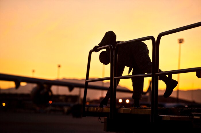 U.S. Air Force Staff Sgt.Barocka Pankins, aerial porter craftsman Joint Base McGuire-Dix-Lakehurst, N.J., removes cargo straps from a 60K Tunner Cargo Loader during Mobility Air Forces Exercise on Nov. 15, 2011, at Nellis Air Force Base, Nev. C-17 Globemaster and C-130 Hercules cargo aircraft will assemble in aerial formations over the Nevada Test and Training Range to conduct air and ground operations as part of the bi-annual U.S. Air Force Weapons School Mobility Air Forces Exercise. (U.S. Air Force photo by Airman 1st Class George Goslin/Released)