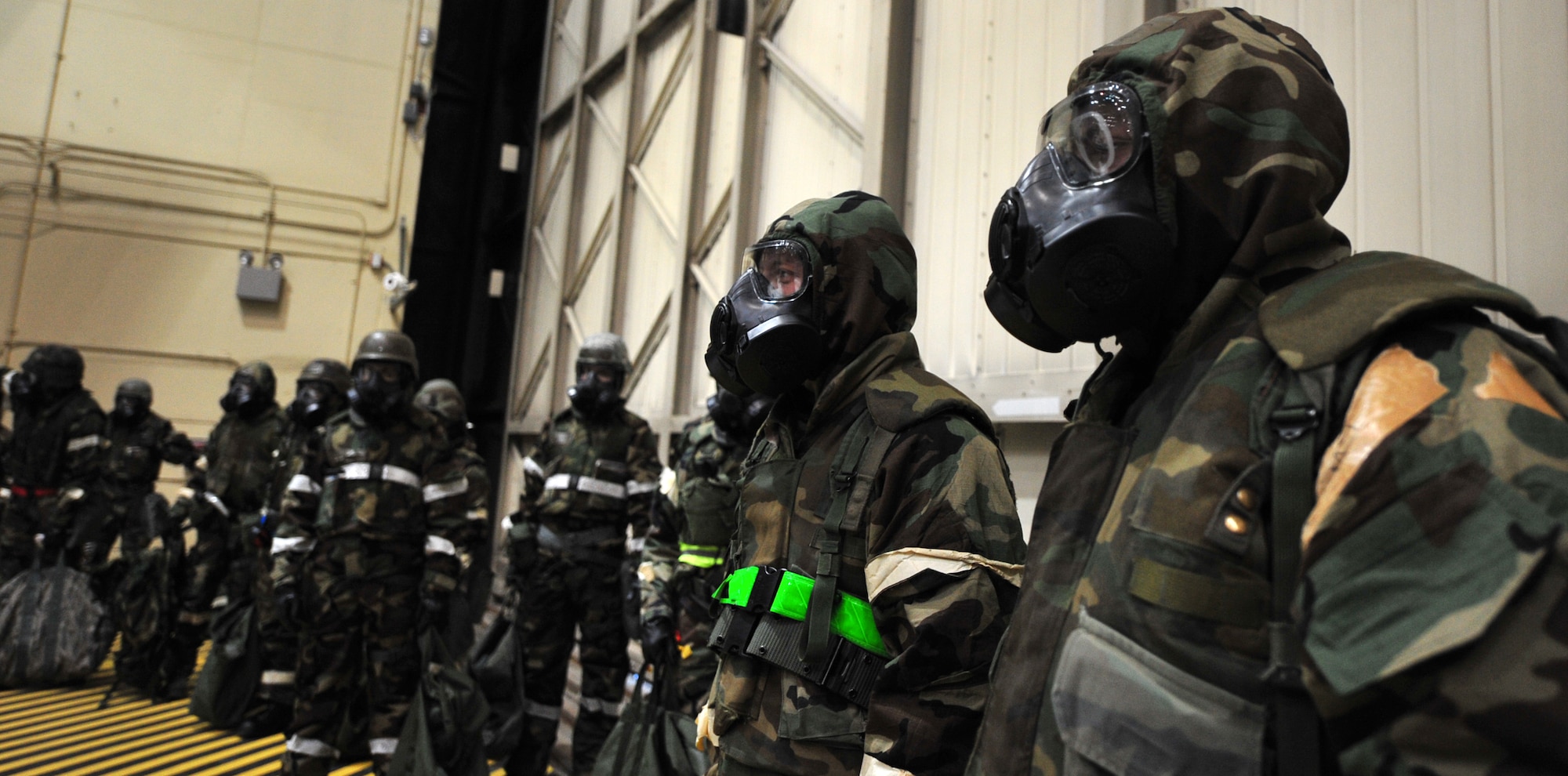 Arctic Warriors wait patiently as they go through the decontamination line during Exercise Polar Force 11-10 at Joint Base Elmendorf-Richardson, Alaska, Nov. 17, 2011. The exercise is made up of a variety of scenarios which test the arctic warriors' ability to handle real world situations. (U.S. Air Force photo/Staff Sgt. Sheila deVera)