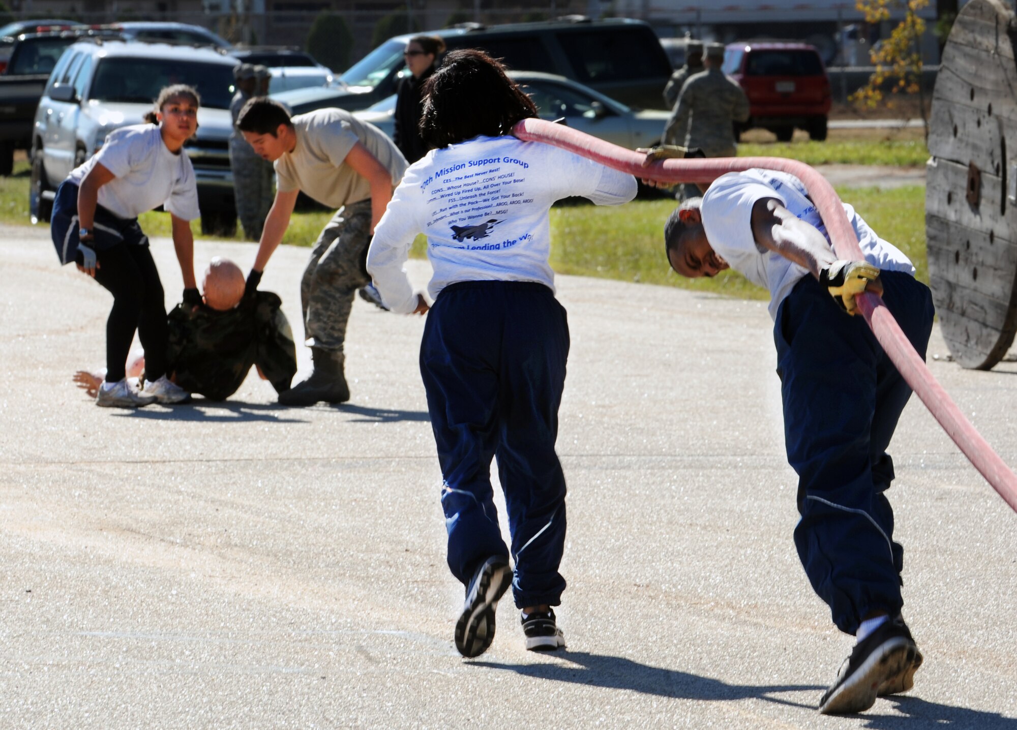 U.S. Air Force Staff Sgt. Nicole Smith, 20th Logistics Readiness Squadron traffic management office logistician, Airman 1st Class Andres Vargas, 20th LRS TMO service center journeyman, Senior Airman Alicia Batista, 20th LRS commander's secretary, Senior Airman Samuel Wilhite, 20th LRS traffic management office logistician, participate in the 20th Mission Support Group Warrior Challenge at Shaw Air Force Base, S.C., Nov. 18, 2011. The 20th MSG held a Warrior Challenge to boost the morale and camaraderie of the Airmen. The 20th MSG Warrior Challenge consisted of a physical training challenge, three-mile rucksack march and an obstacle course. (U.S. Air Force photo by Airman 1st Class Tabatha Duarte/Released)