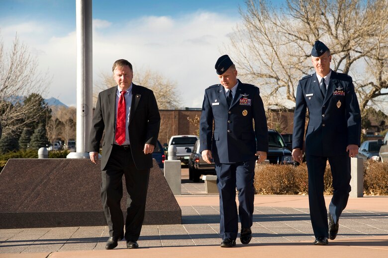 PETERSON AIR FORCE BASE, Colo. - Congressman Doug Lamborn (left), is greeted by Col. Chris Crawford (center) 21st Space Wing commander, and Col. Jeffrey Flewelling, 21st SW vice commander, Nov. 21, 2011, in front of the wing headquarters building. During his visit, Lamborn learned more about the wing’s global missile warning and space control mission, future growth plans and the Cheyenne Mountain Air Force Station mission. He also went on a windshield tour of the base. Lamborn represents Colorado’s 5th Congressional District, and serves on the House Armed Services Committee and House Veterans Affairs Committee. (U.S. Air Force photo/Craig Denton)