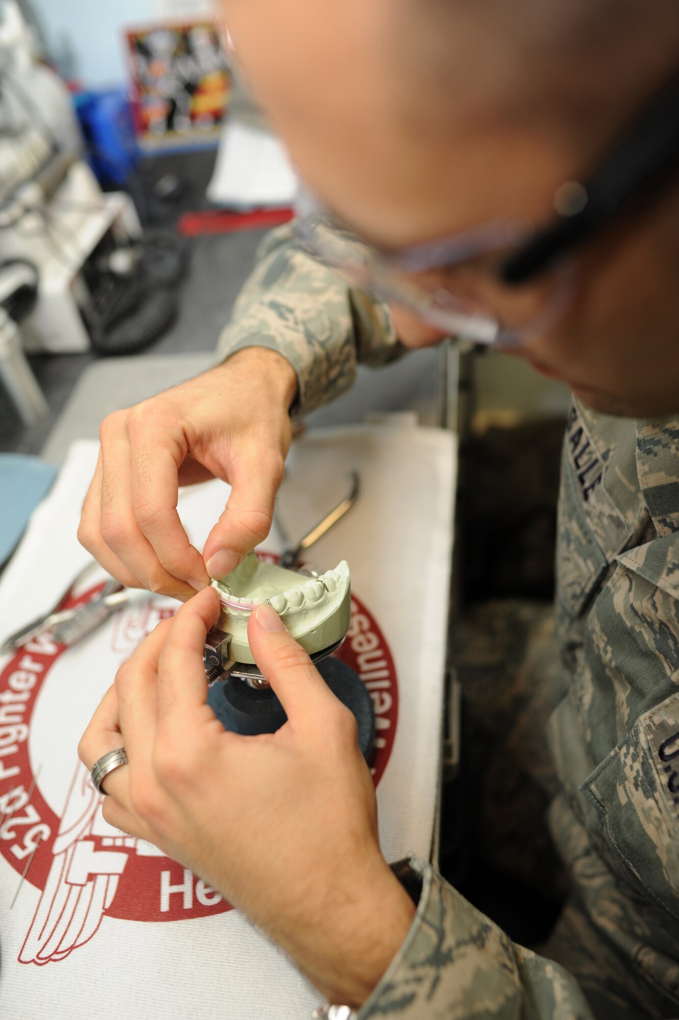 SPANGDAHLEM AIR BASE, Germany – Staff Sgt. Cory La Salle, 52nd Dental Squadron dental lab technician, works on a Hawley retainer here Nov. 22. The dental squadron provides support to Saber Airmen and their families by promoting oral health and delivering professional dental care. (U.S. Air Force photo/Airman 1st Class Matthew B. Fredericks)