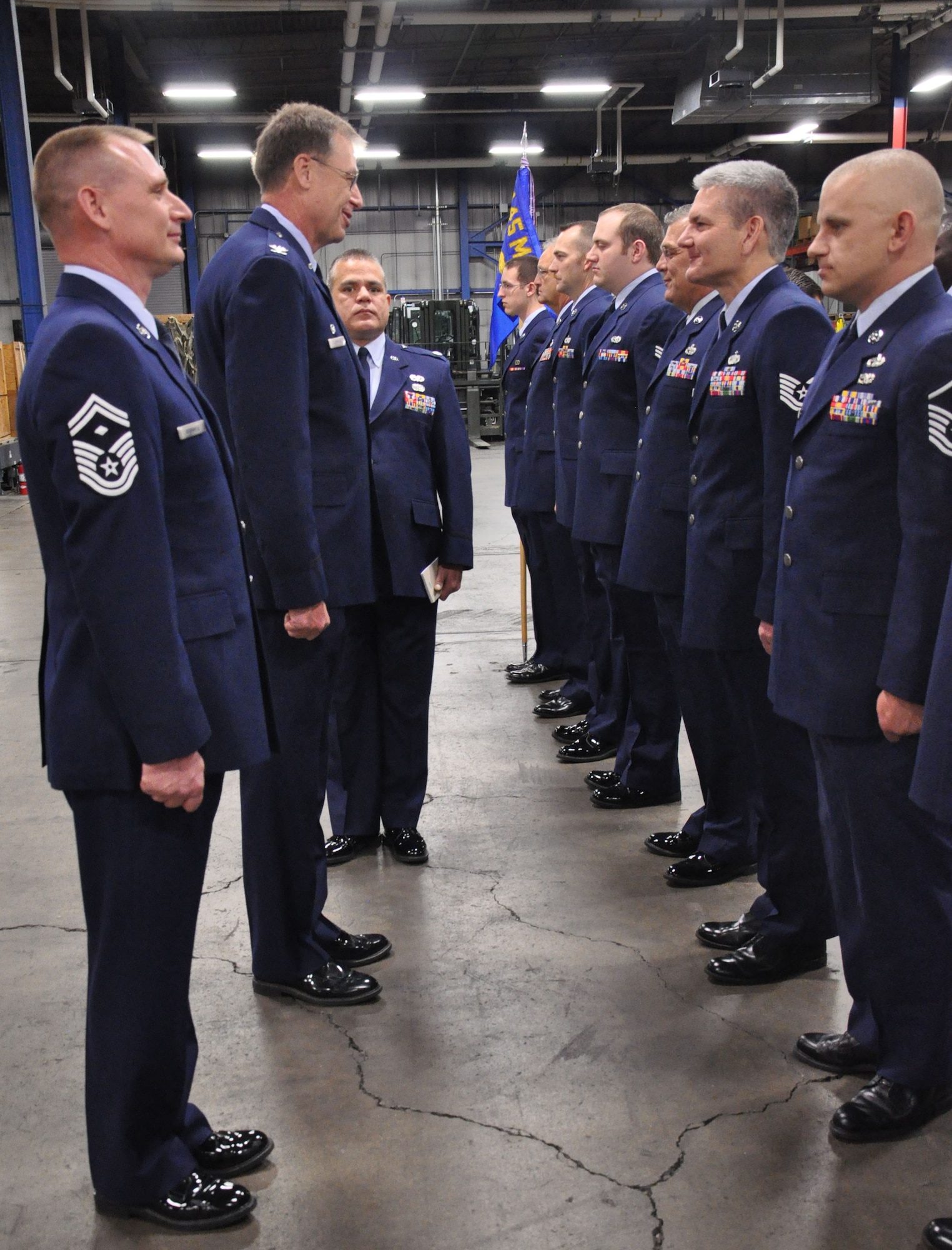WRIGHT-PATTERSON AIR FORCE BASE, Ohio - (left) Senior Master Sgt. Michael Brimmer, 87th Aerial Port Squadron first sergeant, Col. Stephen Goeman, 445th Airlift Wing commander, and Lt. Col. John Marang, 87th APS commander, inspect the uniform and appearance of each 87th APS Airman during an open ranks inspection Nov 20. (U.S. Air Force photo/Staff Sgt. Amanda Duncan)