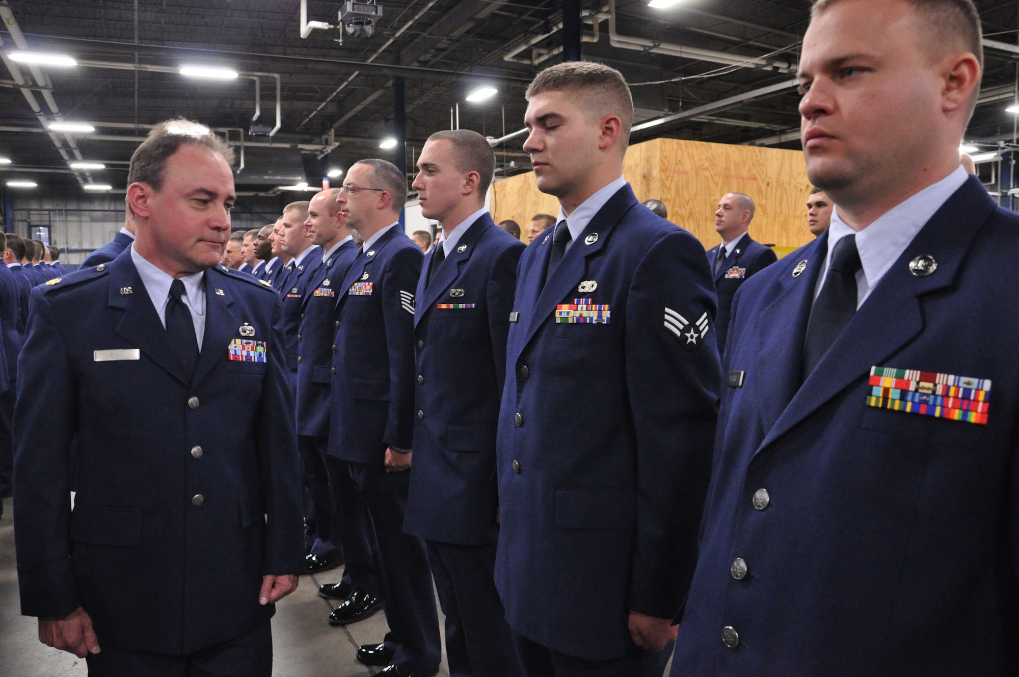 WRIGHT-PATTERSON AIR FORCE BASE, Ohio – Maj. Michael Egan, 87th Aerial Port Squadron, officer in charge of air freight, inspects the uniform and appearance of each 87th APS Airman during an open ranks inspection Nov. 20. (U.S. Air Force photo/Staff Sgt. Amanda Duncan)