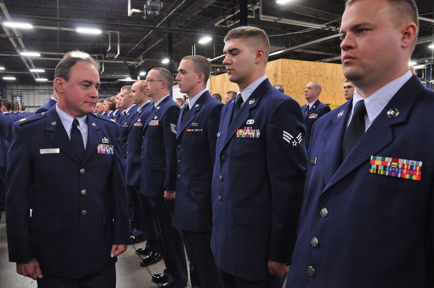 WRIGHT-PATTERSON AIR FORCE BASE, Ohio – Maj. Michael Egan, 87th Aerial Port Squadron, officer in charge of air freight, inspects the uniform and appearance of each 87th APS Airman during an open ranks inspection Nov. 20. (U.S. Air Force photo/Staff Sgt. Amanda Duncan)