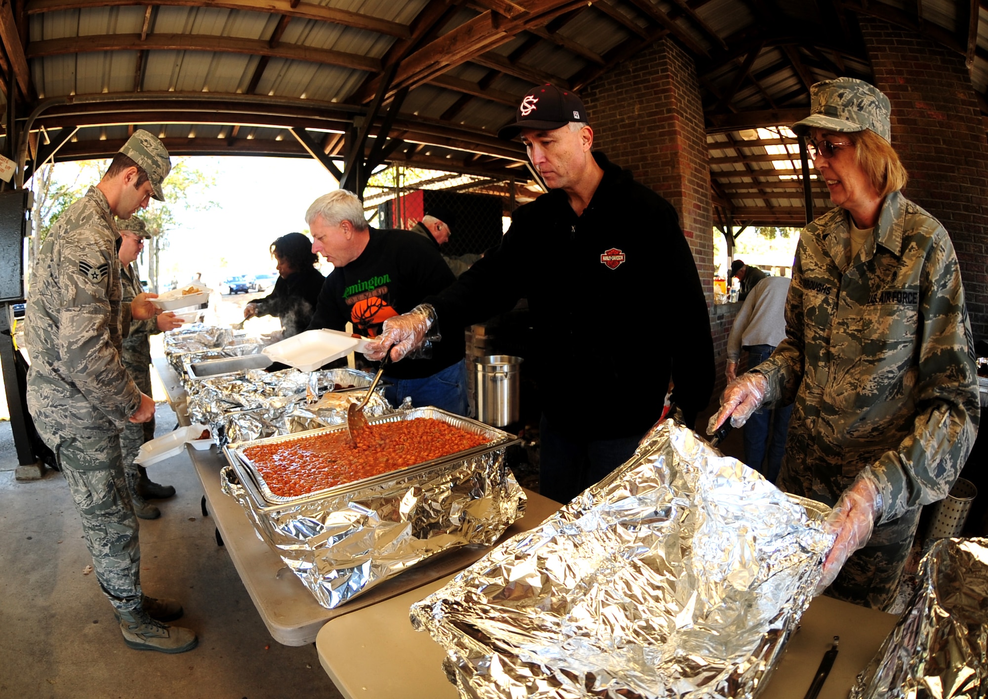 The Joint Base Charleston Chief's group serves Airmen at the picnic grounds Nov. 18. The fish fry is held annually to promote a sense of camaraderie between all units on base. (U.S. Air Force photo/Staff Sgt. Katie Gieratz)
