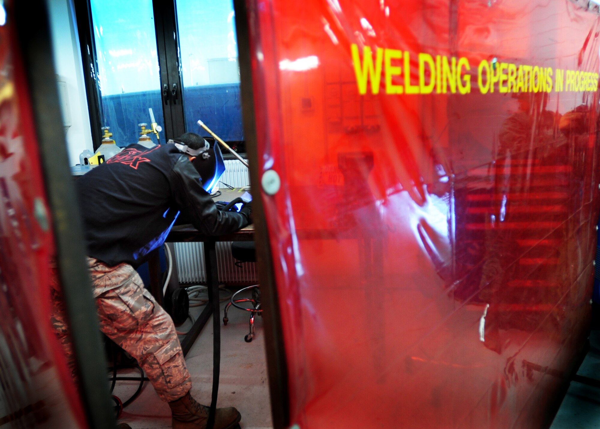 Tech. Sgt. Jesse Swiderek, 31st Maintenance Squadron aircraft metals technology craftsman, welds a piece of scrap metal Nov. 21 at Aviano Air Base, Italy.  Aircraft metals technology shop provides services such as welding for repairs and fabrication of equipment components. (U.S Air Force Photo/Senior Airman Evelyn Chavez)