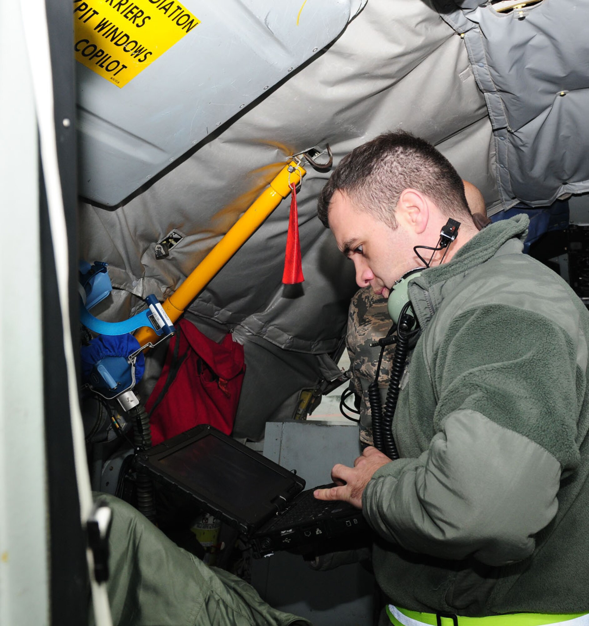 RAF MILDENHALL, England -- Staff Sgt. Brian Bunch, 100th Aircraft Maintenance Squadron APG crew chief, troubleshoots an interphone system on a KC-135 Stratotanker Nov. 9, 2011, during a preflight red-ball maintenance check. Made up of three career fields – crew chiefs, hydraulics and propulsion specialists – APG formerly meant “airplane general,” and though the name is no longer officially used, it’s still kept for its historical roots. The APG crew chiefs include hydraulics and propulsion specialists, and between them, perform vital safety checks on aircraft both before and after flight. Red ball maintenance means any maintenance or safety problems found six hours or less prior to takeoff. Once a problem is found, the crew chiefs either fix it or coordinate the repair as quickly as possible. (U.S. Air Force photo/Karen Abeyasekere)