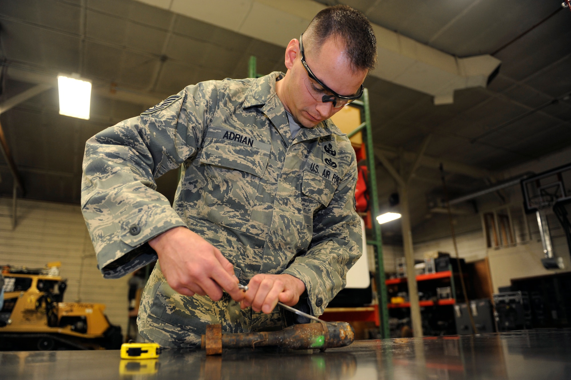 Tech Sgt. Andrew Adrian measures a mortar in the 673rd Explosive Ordinance Disposal shop, Joint Base Elmendorf-Richardson, Alaska Nov. 18, 2011. Adrian earned a bronze star for actions performed during his deployment in support of Operation Enduring Freedom in Afghanistan. Adrian is an Explosive Ordinance Disposal team leader. (U.S. Air Force photo/Staff Sgt Robert Barnett)