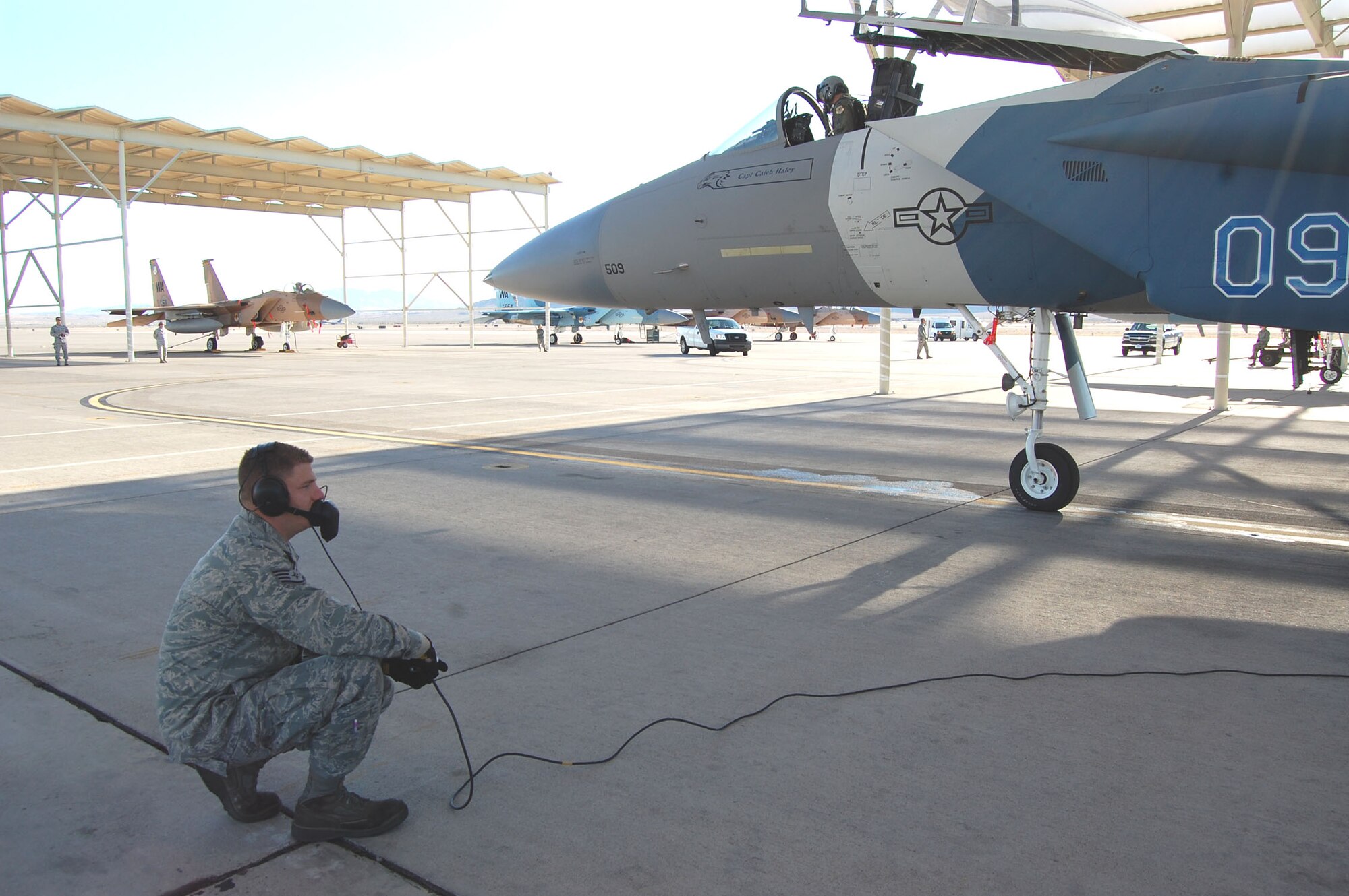 U.S. Air Force Staff Sgt. Samuel Schumach, 926th Aircraft Maintenance Squadron Aggressor crew chief, prepares to launch the first American F-15 Eagle aircraft painted to replicate a Russian SU-35 Nov. 5, 2011, on Nellis Air Force Base, Nev. This aircraft was part of an F-15 two-ship that flew over the Mesquite Veterans Day parade. Schumach is a traditional reservist who, in his civilian capacity, works at a hotel on the Las Vegas Strip and is a full-time student at the University of Nevada, Las Vegas. (U.S. Air Force photo by Capt. Jessica Martin)