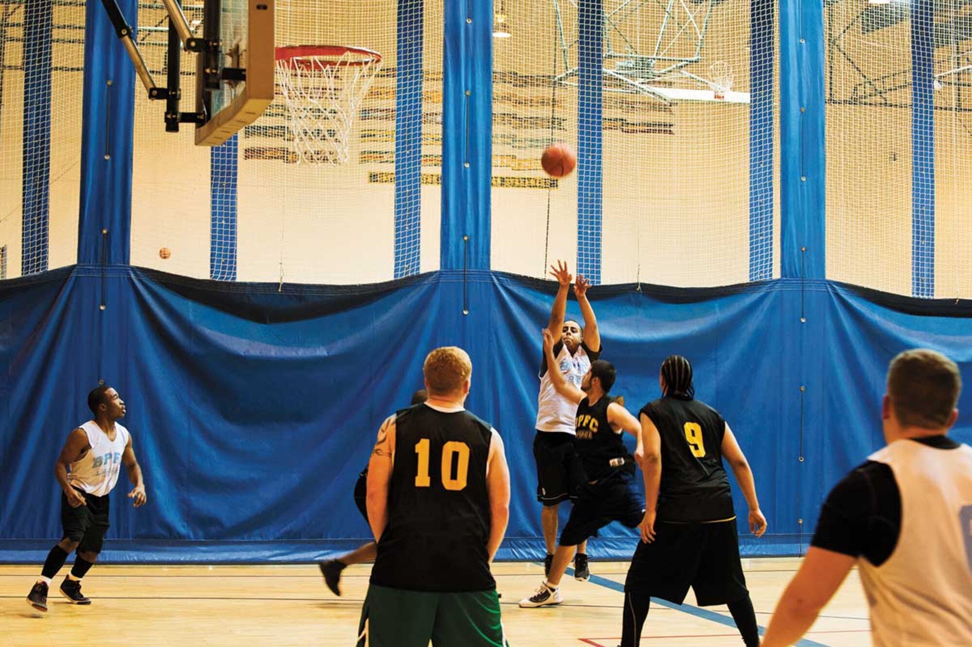 Anthony Urzi, military family member, shoots free throws during an intramural basketball game against A Company, 3rd Battalion (Airborne), 509th Infantry Regiment at Buckner Physical Fitness Center on Joint Base Elmendorf-Richardson  Monday. Members of A/725th BSB beat B/3-509th 68-53. (U.S. Air Force photo/Staff Sgt. Zachary Wolf)