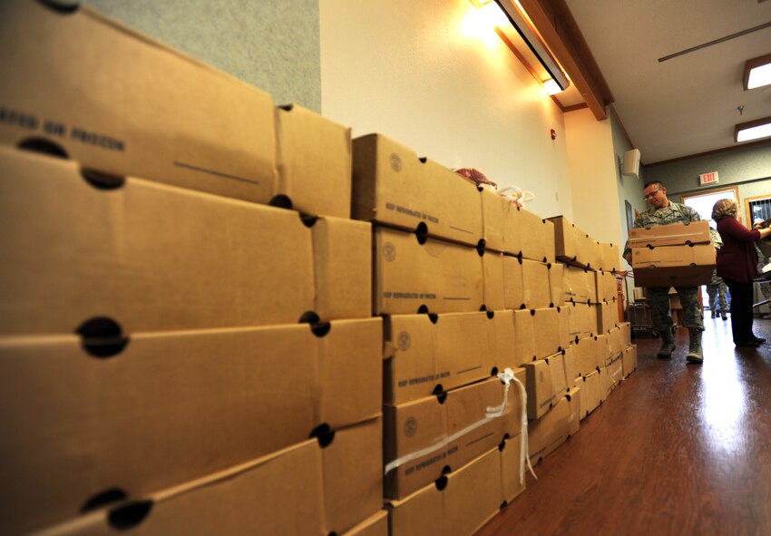 More than $2,000 worth of frozen turkeys line the chapel annex wall during the Thanksgiving Basket Giveaway Nov. 22, 2011, McConnell Air Force Base, Kan. McConnell first sergeants donated the turkeys to add to “baskets” of groceries to make a traditional Thanksgiving meal. (U.S. Air Force photo/ Airman 1st Class Laura L. Valentine)