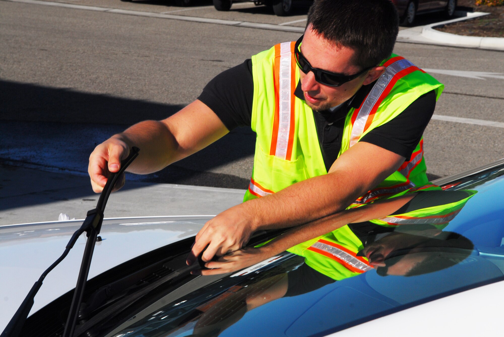VANDENBERG AIR FORCE BASE, Calif. – Nick Hankinson, from the 30th Space Wing Safety Office,   examines a windshield wiper during a free vehicle safety check inspection at the Army and Air Force Exchange Service Car Care Center’s parking lot here Wednesday, Nov. 23, 2011. (U.S. Air Force photo/Senior Airman Steve Bauer)    