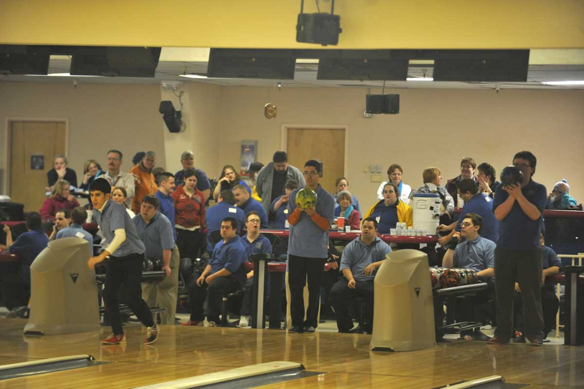 The Special Olympics Anchorage team “Good Ole Boys” exhibit fine-tuned teamwork with synchronized bowling at the Polar Bowl center on Sunday. The three-day tournament brought representatives from seven Alaskan communities to the bowling center. Each individual bowler brought his or her own talents and techniques. Bowlers were divided into seven squads and each bowled nine games resulting in 2,124 games bowled. (U.S. Air Force photo/Airman 1st Class Ty-Rico Lea)