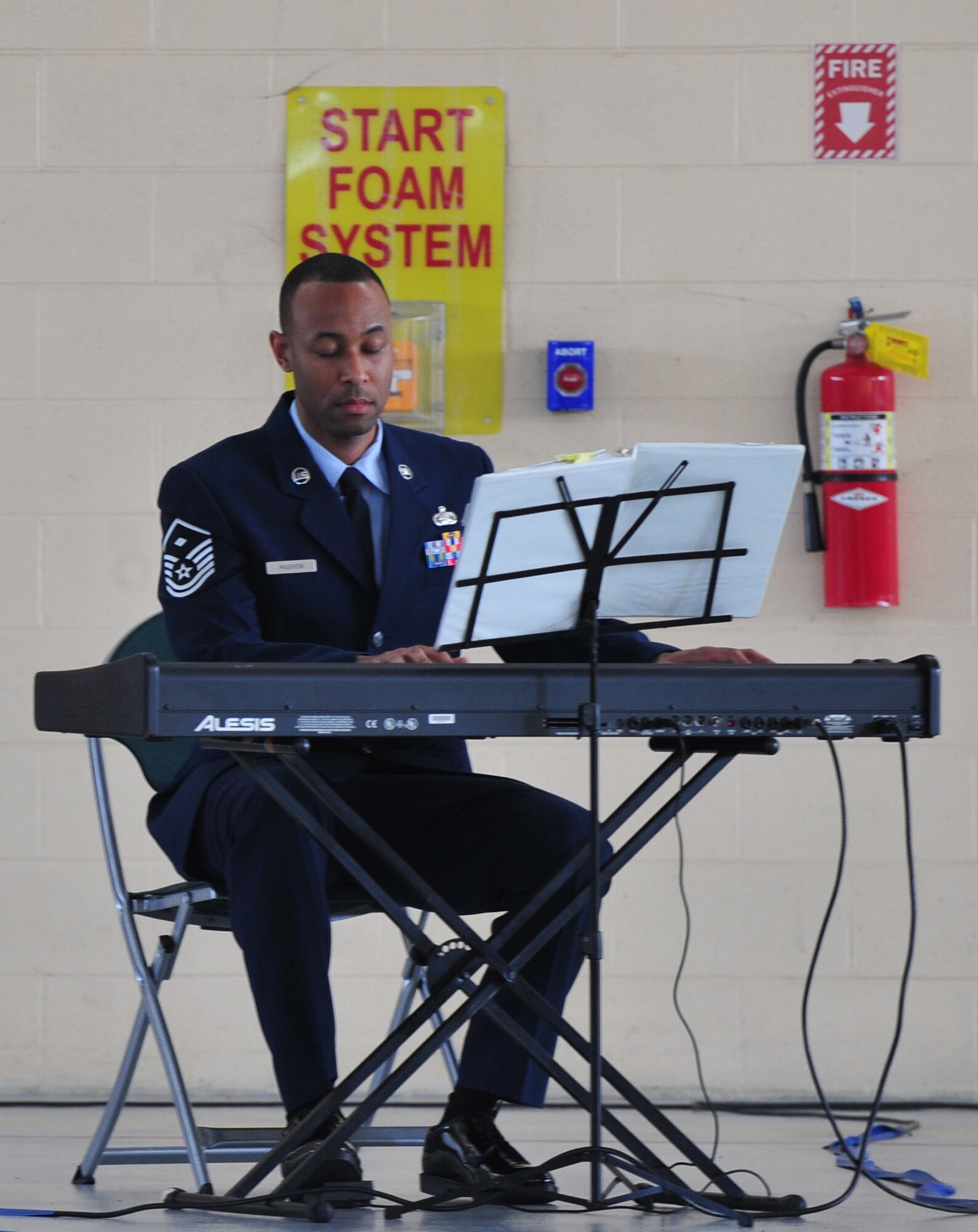 U.S. Air Force Master Sgt. Max Marbron, 23rd Component Maintenance Squadron first sergeant, plays a rendition of “Amazing Grace” during a memorial service for three fallen Airmen at Moody Air Base, Ga., Nov. 22, 2011. The three Airmen were involved in a single-vehicle automobile accident that occurred on Nov. 13, 2011. (U.S. Air Force photo by Staff Sgt. Stephanie Mancha/Released)
