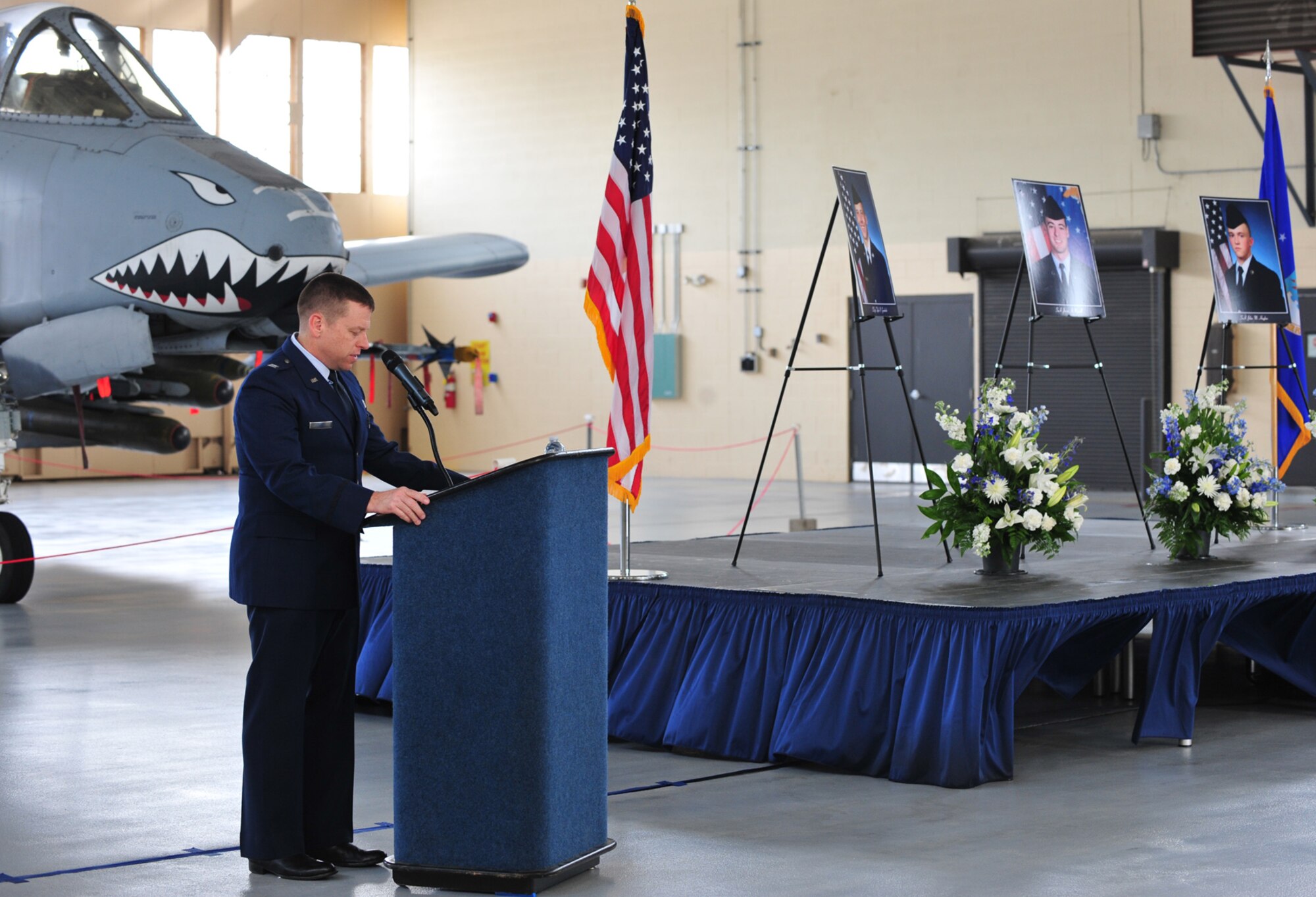 U.S. Air Force Capt. Tony King, 23rd Wing Protestant chaplain, gives words of comfort to the attendance of the memorial service of three fallen Airmen at Moody Air Force Base, Ga., Nov. 22, 2011. The three Airmen were in single-vehicle automobile accident that occurred on Nov. 13, 2011. (U.S. Air Force photo by Staff Sgt. Stephanie Mancha/Released)
