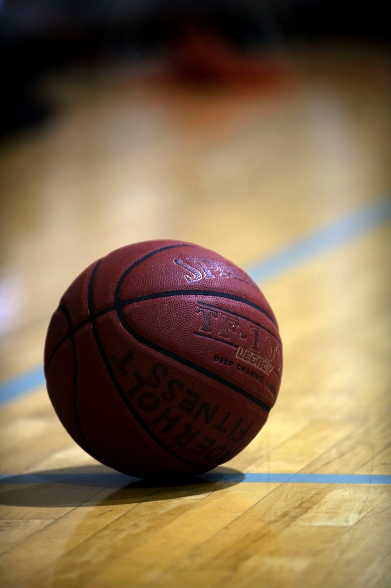 A basketball lies on the court during a basketball game at the Aderholt Fitness Center on Hurlburt Field, Fla., Nov. 19, 2011. The Hurlburt Field Commandos defeated the Eglin Eagles with a 20 point lead, resulting in a 101 to 81 victory.  (U.S. Air Force photo/Airman 1st Class Gustavo Castillo)(Released)