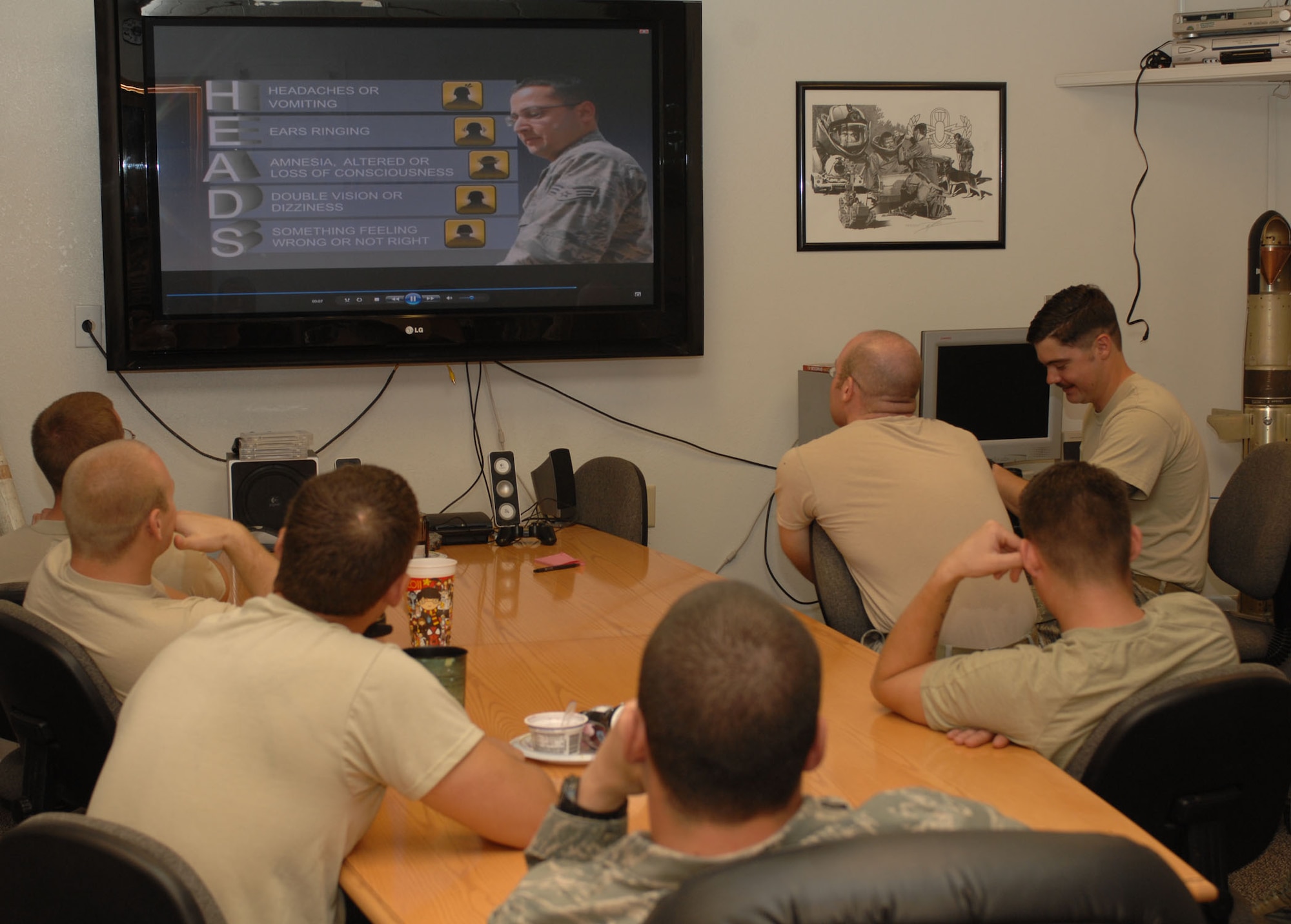 Members of the 355th Civil Engineer Squadron's explosive ordnance disposal flight learn the HEADS acronym used to self-identify a potential traumatic brain injury during the fourth-annual Air Force-wide EOD Safety Day held at Davis-Monthan Air Force Base, Ariz., Nov. 17, 2011. The down-day served as an opportunity to educate EOD Airmen on issues affecting the career field and inform them of resources to assist them and their families. (U.S. Air Force photo by Senior Airman Shane Dunaway/released)
