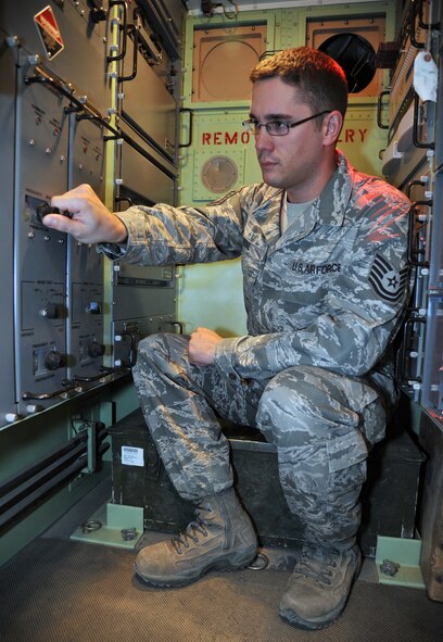 U.S. Air Force Tech Sgt. Daniel Heise performs receive signal level checks on the digital modem and adjusting the receiver frequency as part of his duties as the NCO-in-charge for the tropospheric scatter element for Alpha Battery, 1-44 Air Missile Defense Battalion at the 387th Air Expeditionary Group, Nov. 12, at an undisclosed location in Southwest Asia. The communications terminal allows the Patriot Missile Battery to receive and transmit radio and data traffic to the launch control battery at a different location. Heise is currently deployed from the 728th Air Control Squadron at Eglin Air Force Base, Fla. (U.S. Air Force photo/Master Sgt. Carlotta Holley)