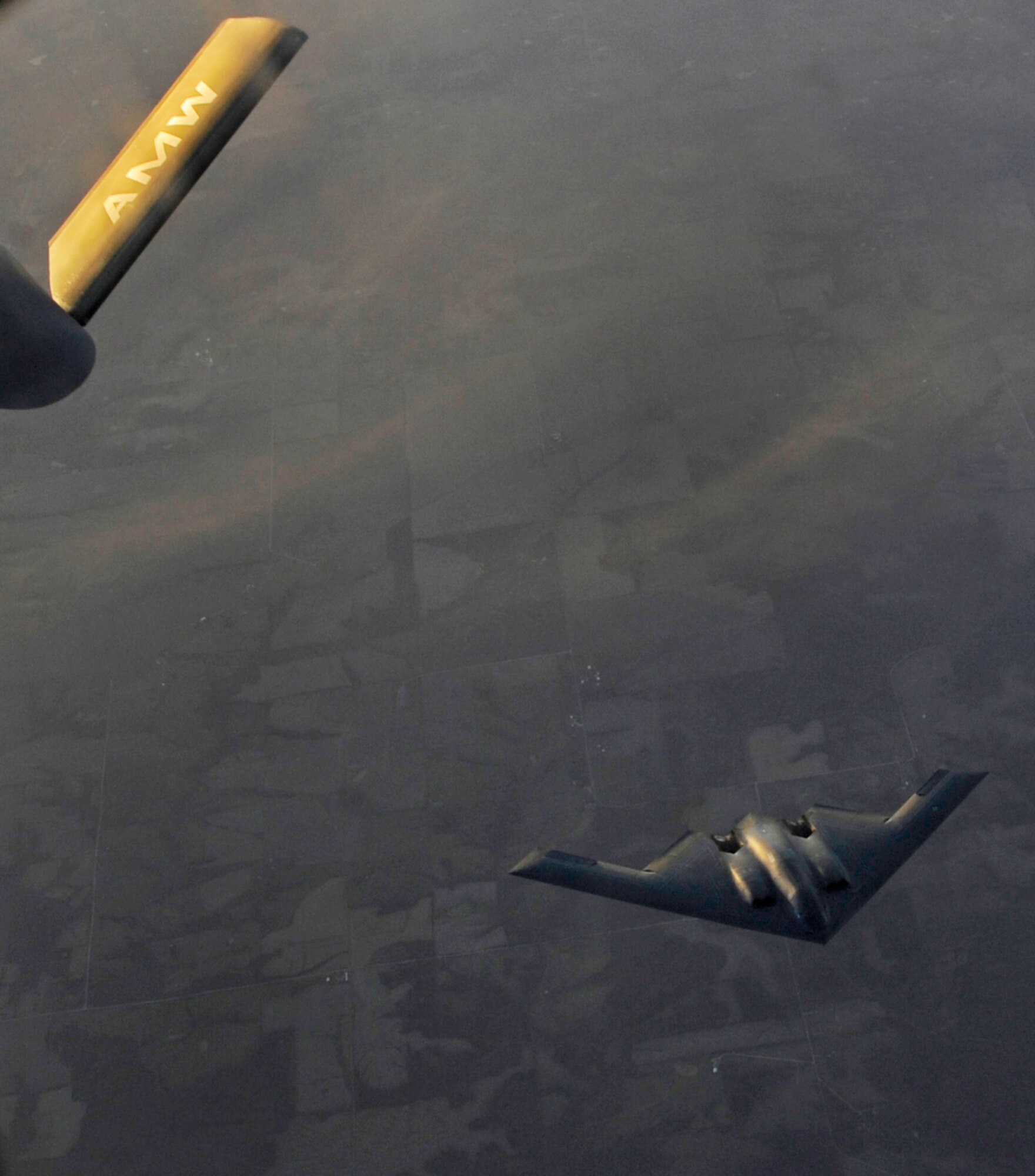 WHITEMAN AIR FORCE BASE, Mo. - A B-2 Spirit resumes its flight patter after receiving fuel from a KC-135 Stratotanker over Kansas Nov. 16. (U.S. Air Force photo/Staff Sgt. Alexandra M. Boutte) (RELEASED)