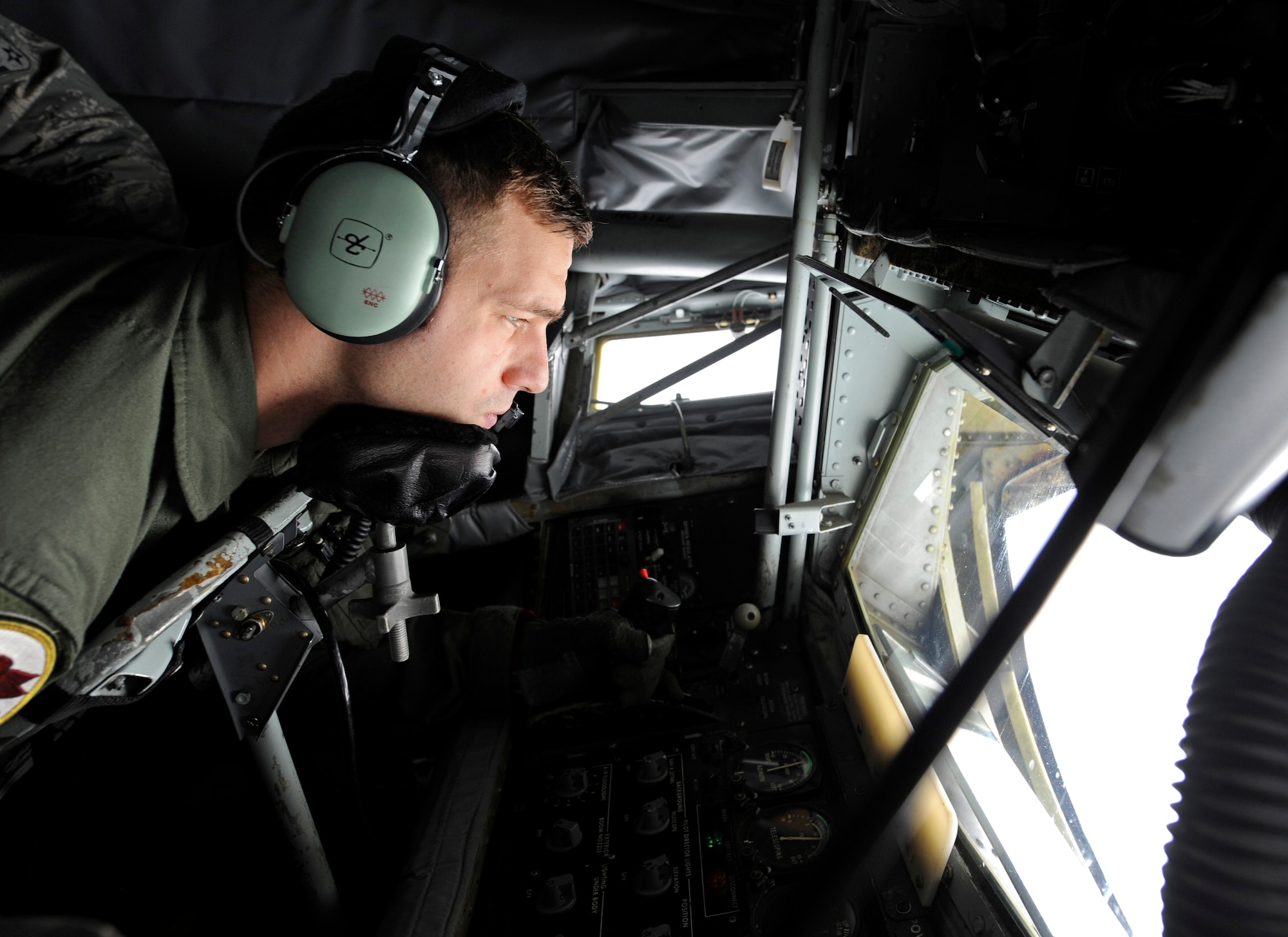 WHITEMAN AIR FORCE BASE, Mo. - Staff Sgt. Jeremy Welch, 509th Weapons Squadron boom operator, prepares to refuel a Joint- STAR aircraft during the SMOKEX Exercise over Kansas Nov. 16. The KC-135 transfers fuel at about 16 gallons per second. (U.S. Air Force photo/Staff Sgt. Alexandra M. Boutte) (RELEASED)