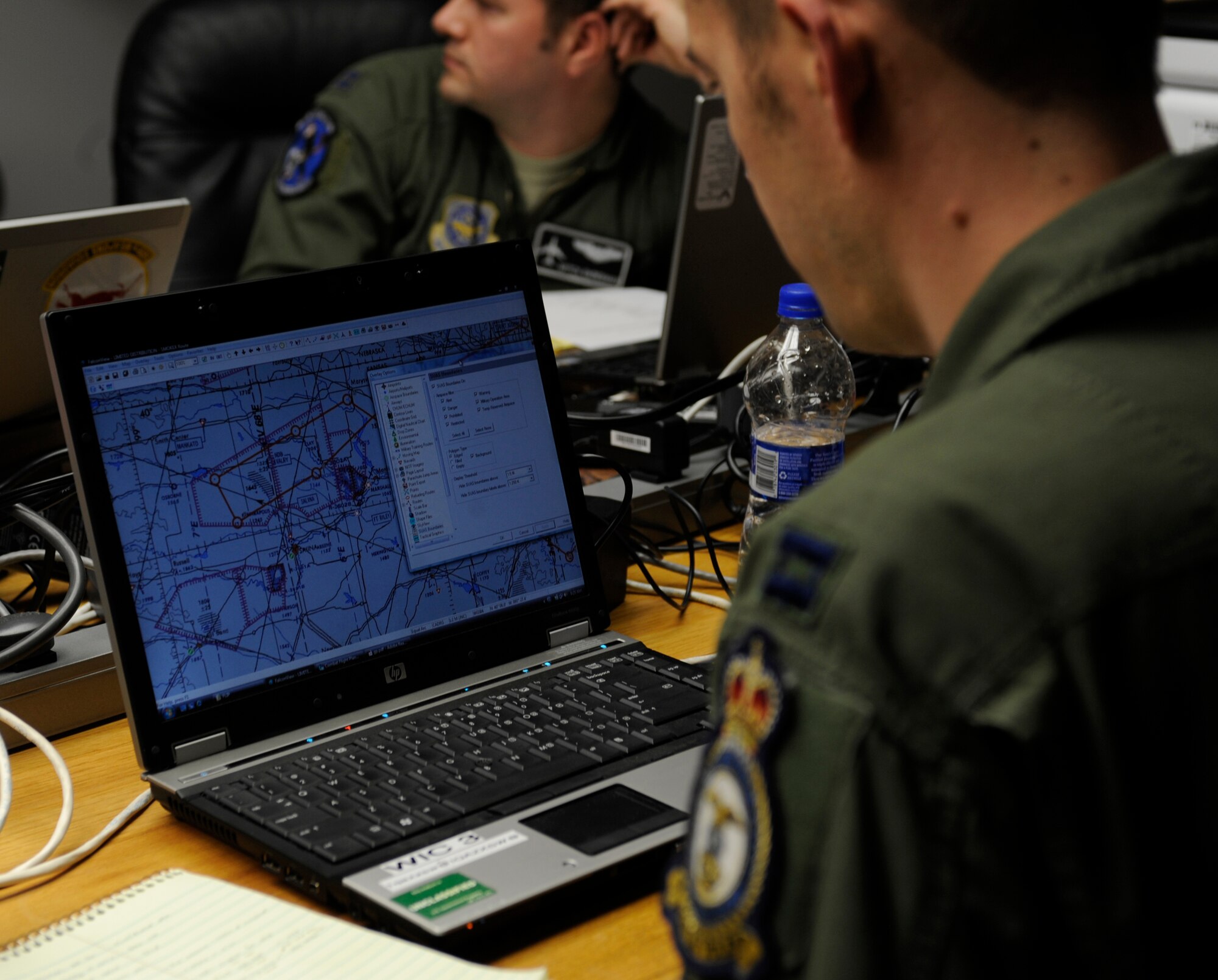 WHITEMAN AIR FORCE BASE, Mo. -- Capt. Doug Murphy, 509th Weapons Squadron, USAF Weapons School at Fairchild Air Force Base, Wa., reviews mission plans for their flight during the SMOKEX exercise over Kansas Nov. 16. SMOKEX is a large force exercise and runs the Smokey Hill Air National Guard unit near Salina, Kan. (U.S. Air Force photo/Staff Sgt. Alexandra M. Boutte) (RELEASED)