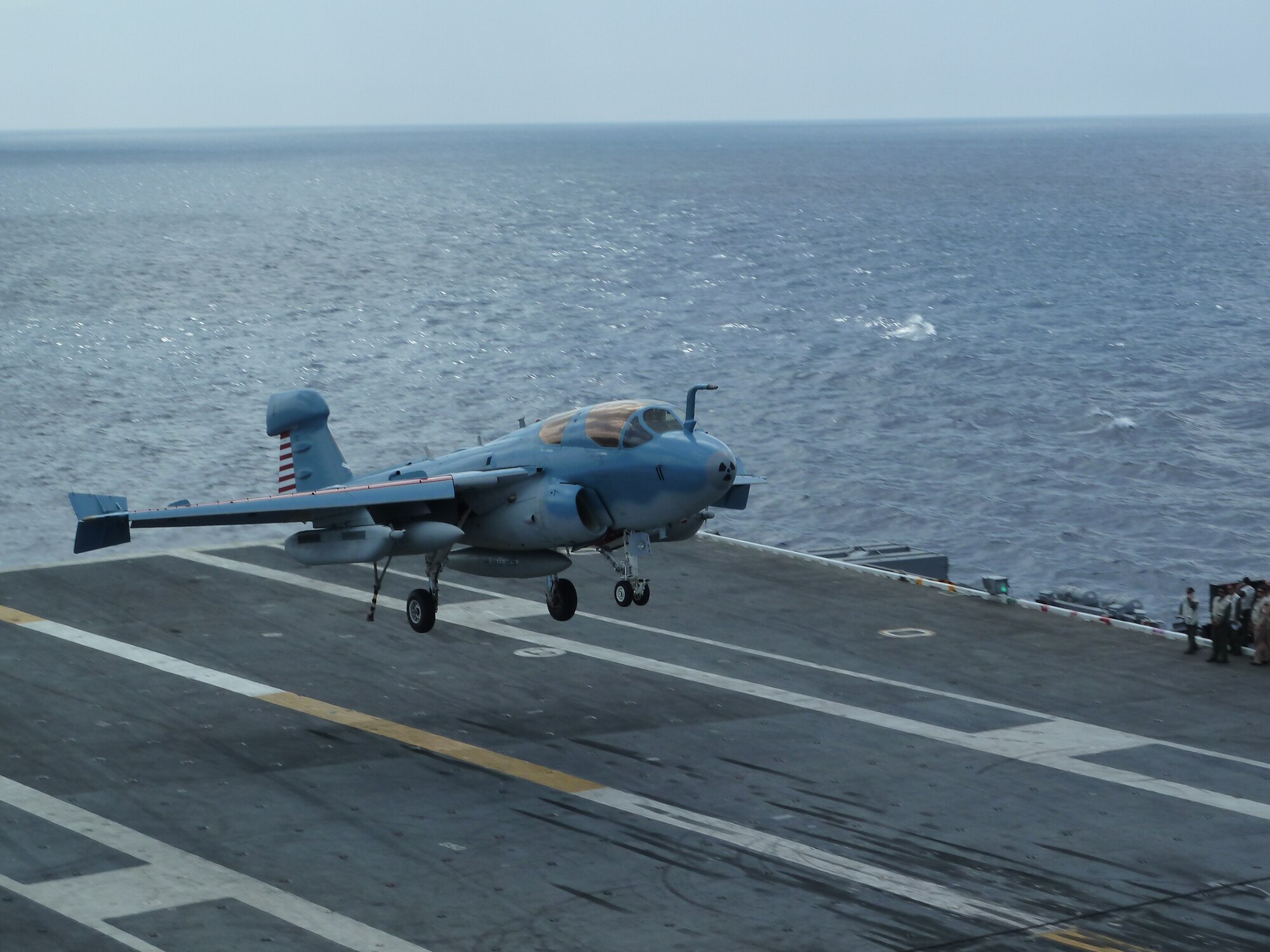 An EA-6B Prowler comes in for a landing aboard the Nimitz-class aircraft carrier USS Dwight D. Eisenhower (CVN 69) July 10, 2011, during carrier qualifications while underway in the Atlantic Ocean. Throughout carrier qualifications pilots are tested on their ability to land in both day and night situations. (Courtesy photo)