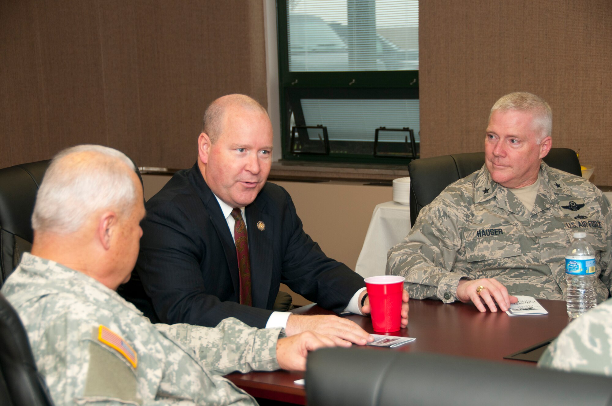 Hulman Field, Ind. – Congressman Larry Bucshon (IN-08), Adjutant General of Indiana Maj. Gen. R. Martin Umbarger, and Assistant Adjutant General of Air Brig. Gen. Jeff Hauser, discuss military concerns during a visit to the 181st Intelligence Wing Nov. 22, 2011.  Photo by Senior Master Sgt. John S. Chapman