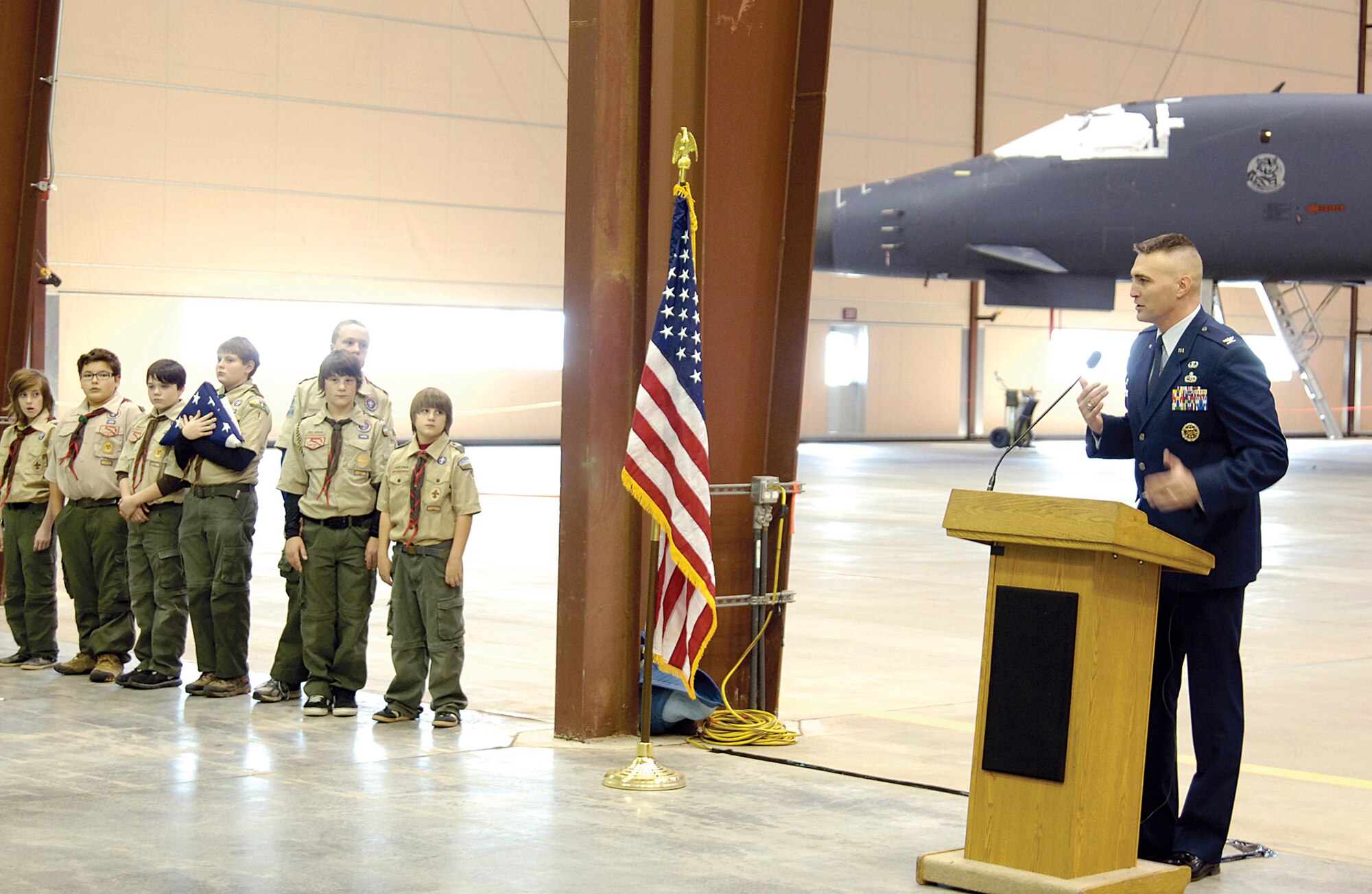 Col. Michael Tannehill, 76th Aircraft Maintenance Group commander, helps recognize the fifth anniversary of the Maintenance, Repair and Overhaul facility Nov. 17 in one of its hangars located across Tinker on Douglas Boulevard. Boy Scout Troop 1 of Edmond later raised a flag at the entrance of the Boeing property. “This five-year anniversary is a great time to reflect that over 100 aircraft transfers have come from Tinker to these hangars,” the commander said of the Boeing/Tinker depot facility partnership. “The MRO has made us better, faster and cheaper,” he added. “The facility has contributed greatly to our overall effectiveness in returning aircraft to the warfighter. This is a win/win for the Air Force and Navy. Thank you!” (Air Force photo by Margo Wright
